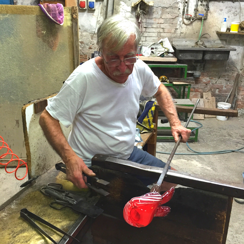 Master glass artisan working in Murano, Italy