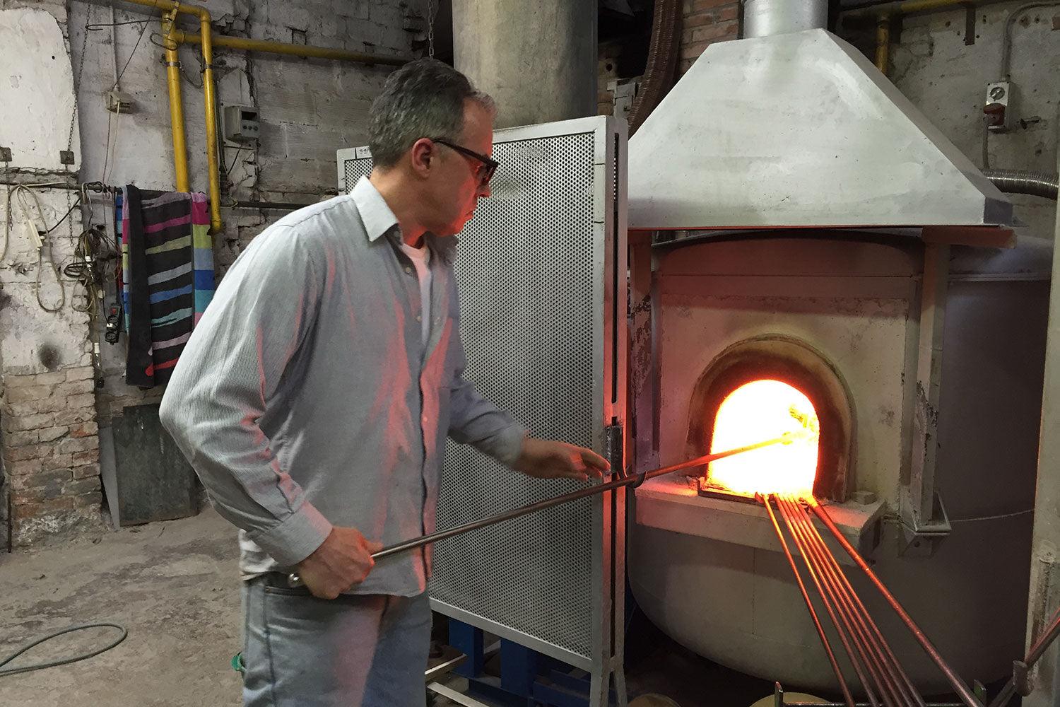 Italian glass maker at furnace in Murano, Italy