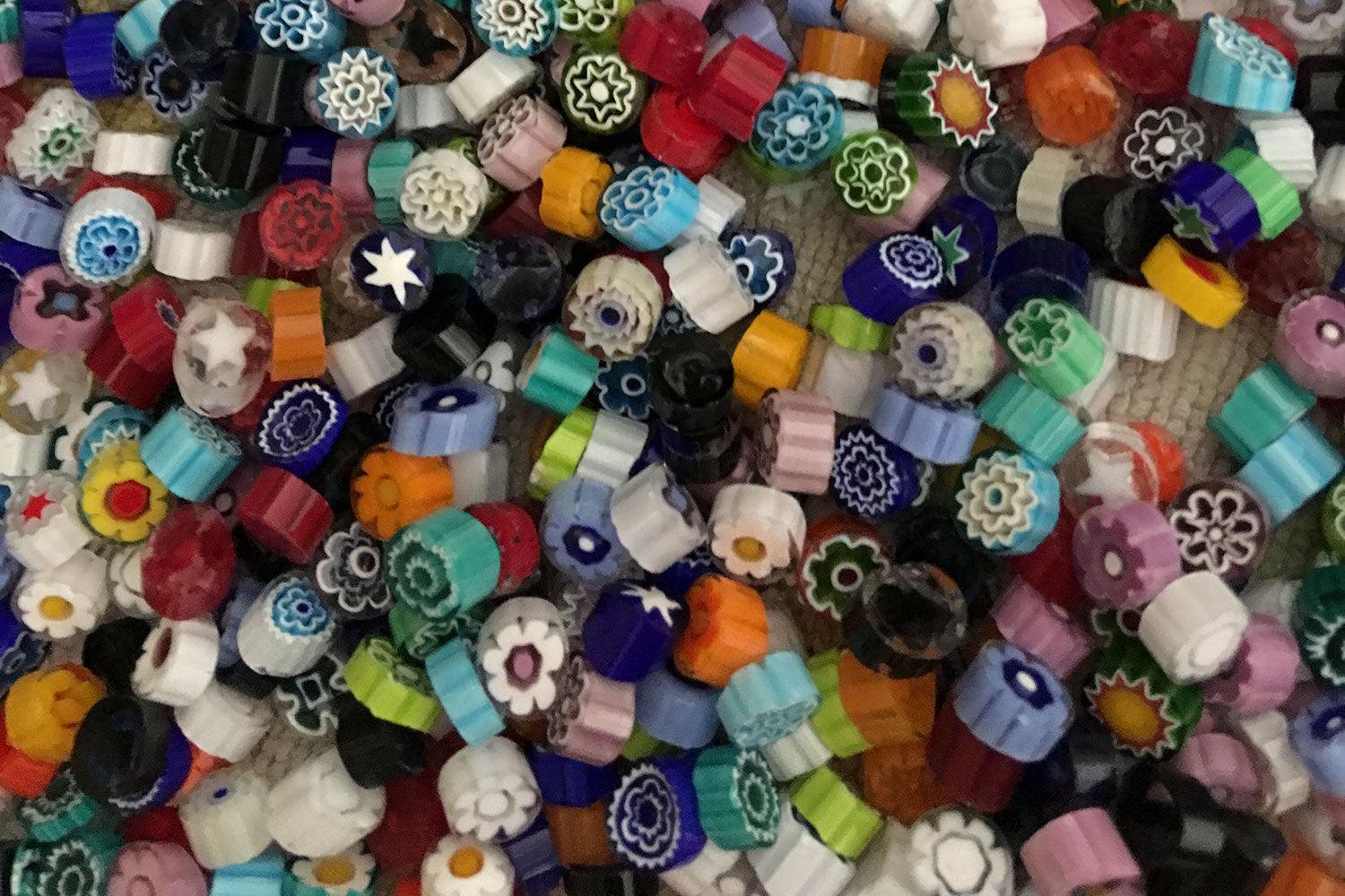Close up of Murano glass millefiori mosaic chips, used in glassmaking technique.