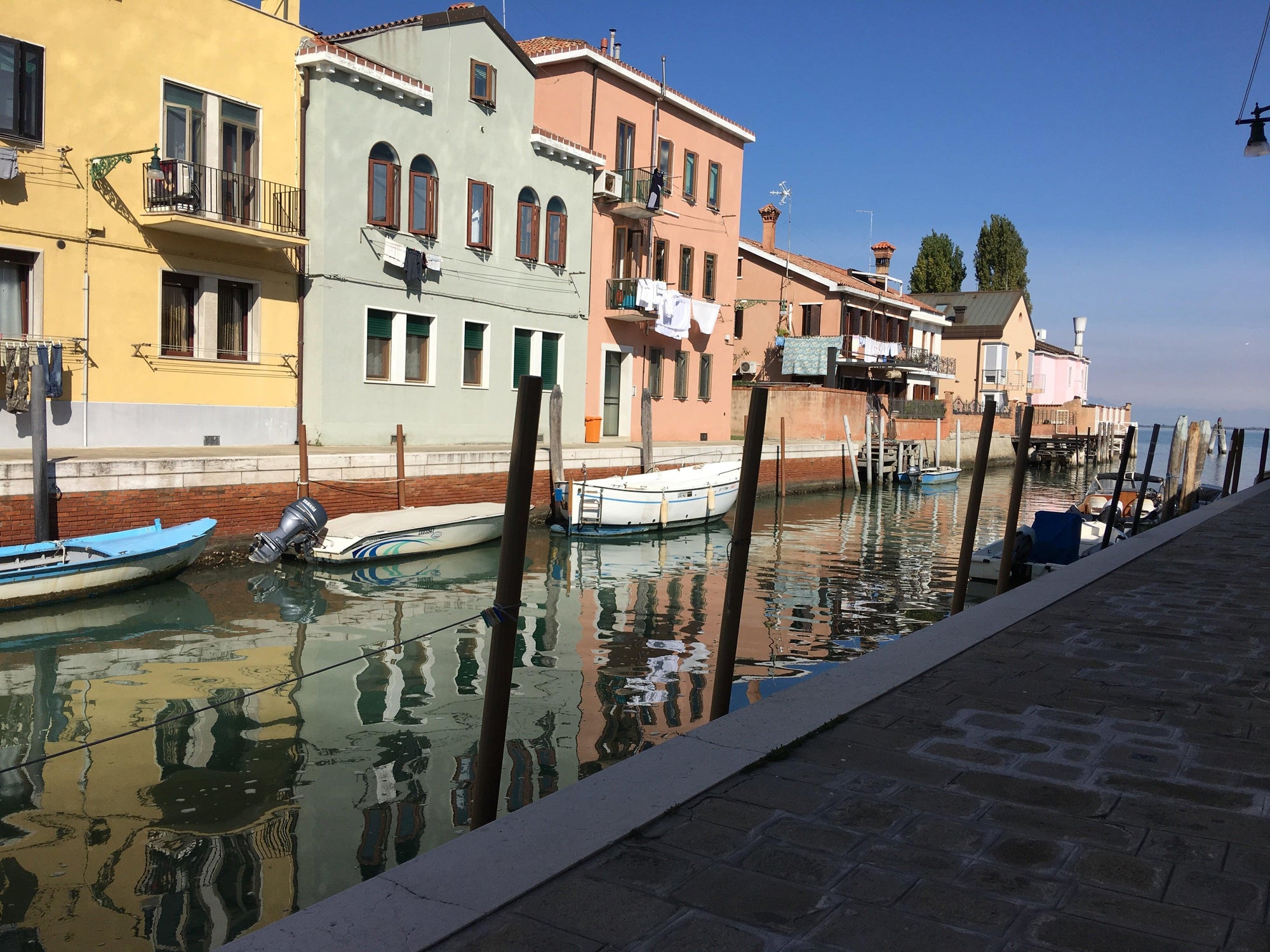 Beautiful photo of Murano Italy, buildings, boats and water.