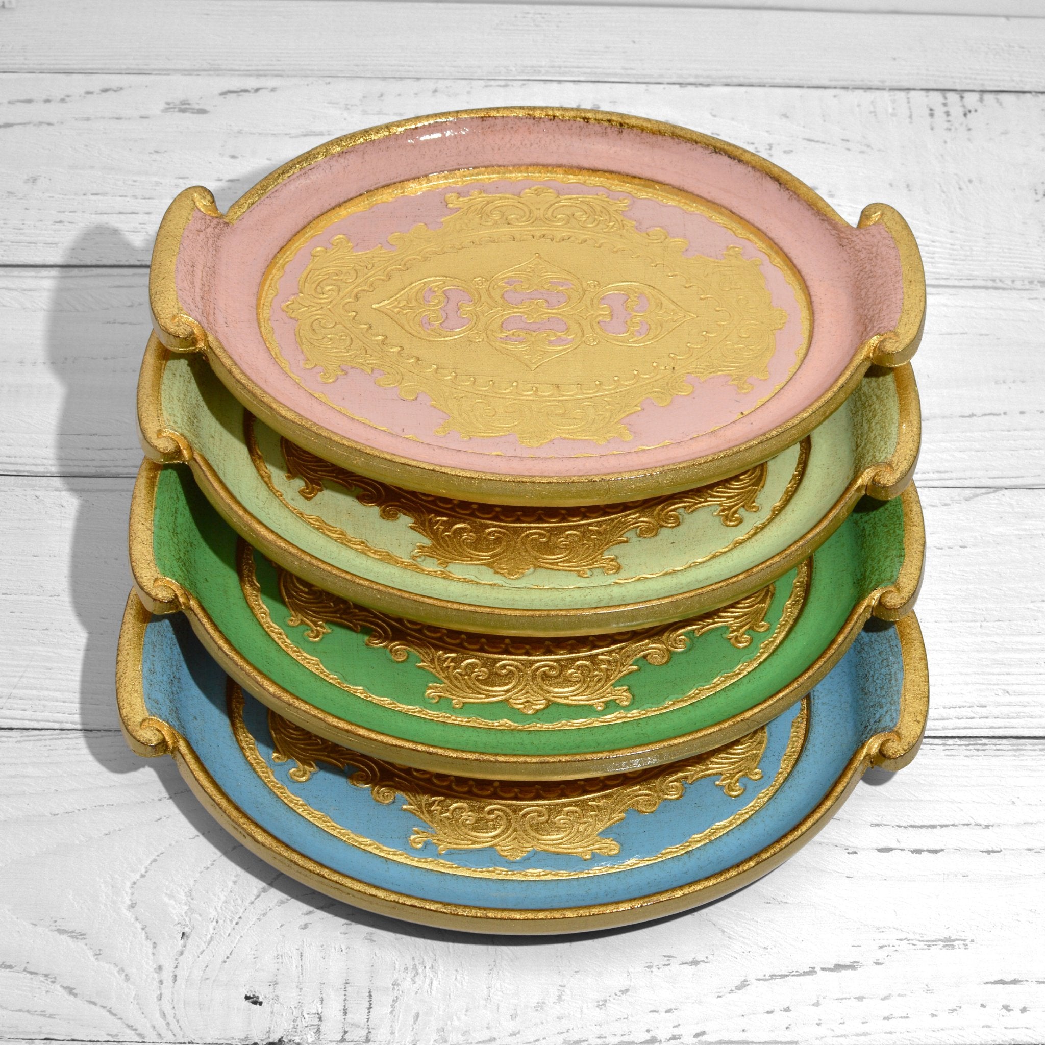 Decorative Florentine carved wood small oval tray with handles, featuring intricate design, ideal for home decor or serving.