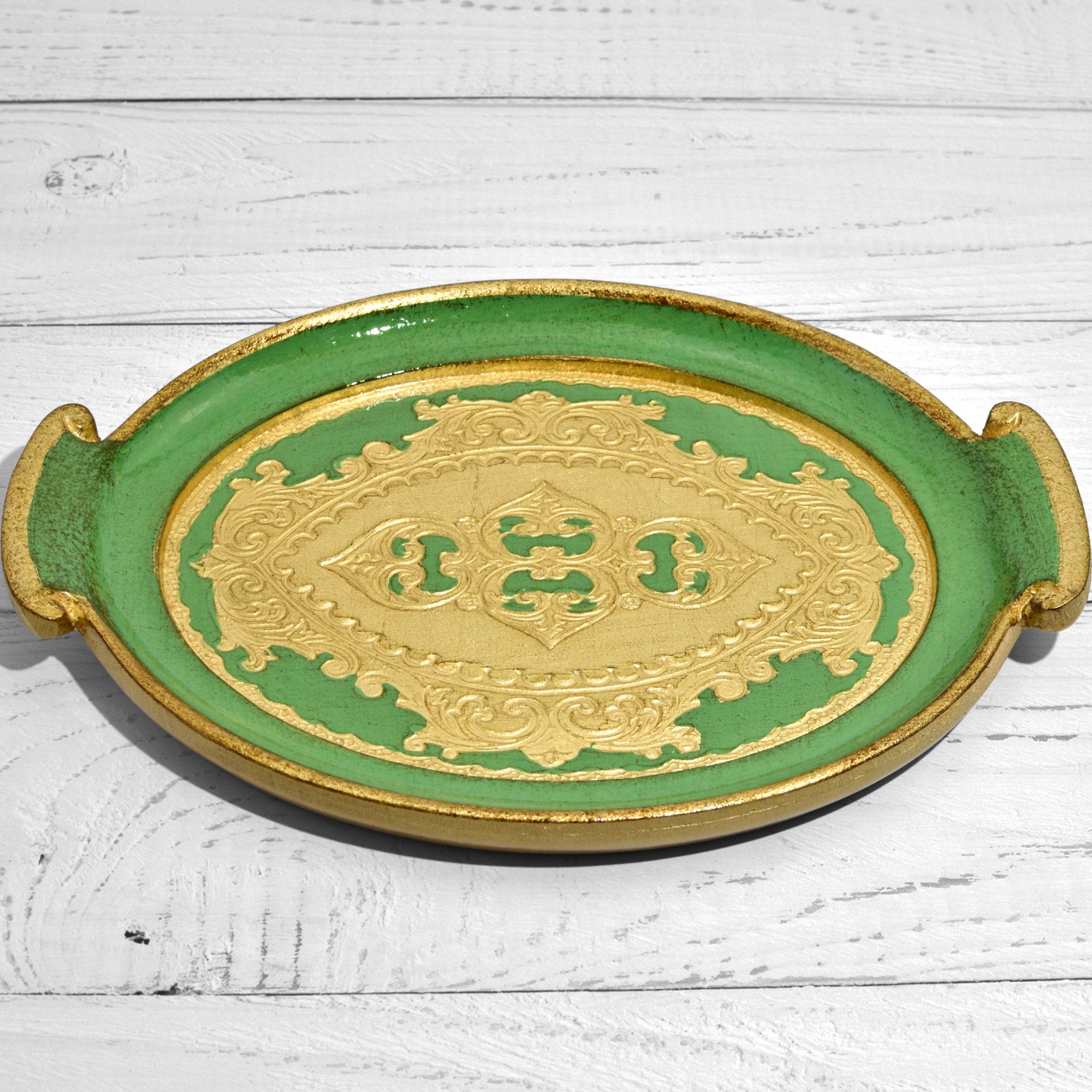 Decorative Florentine carved wood small oval tray with handles, featuring intricate Italian design and craftsmanship.