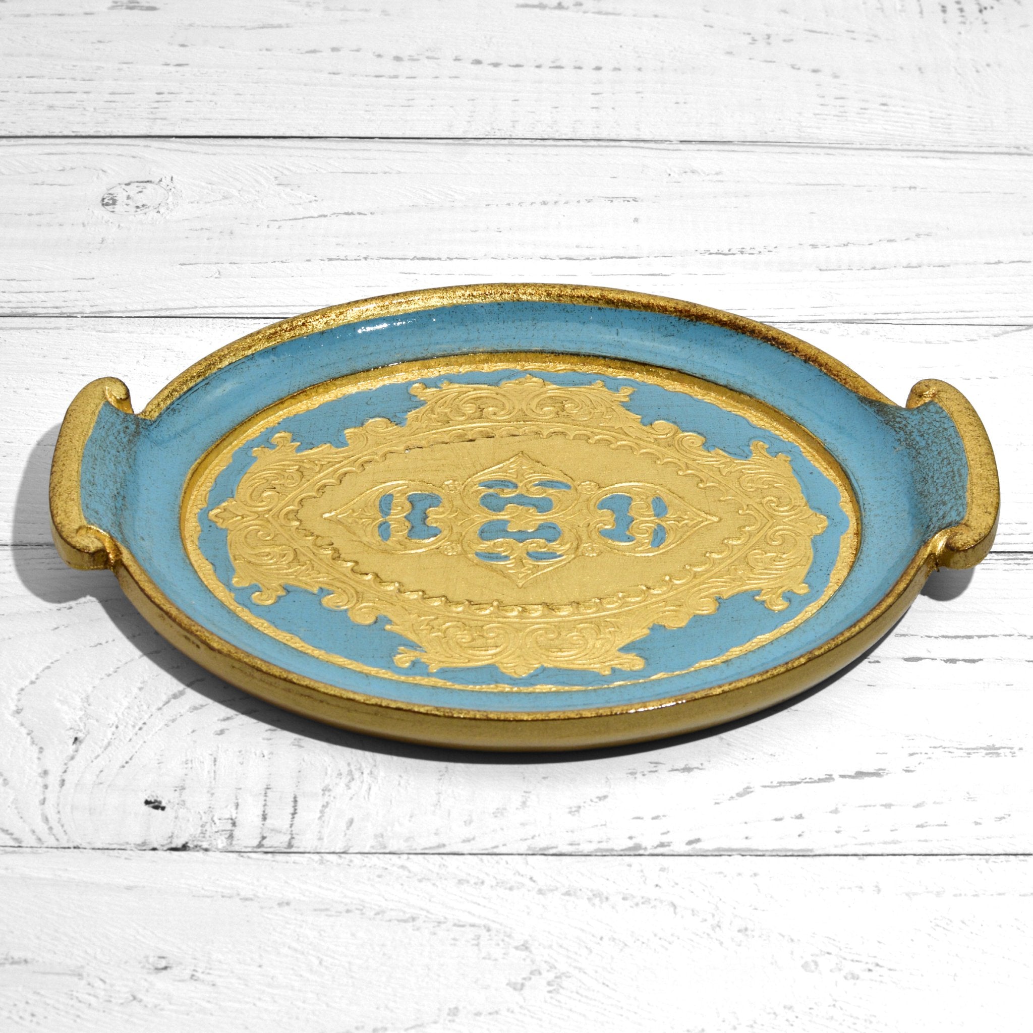 Decorative Florentine carved wood small oval tray with handles, featuring intricate Italian design and craftsmanship.