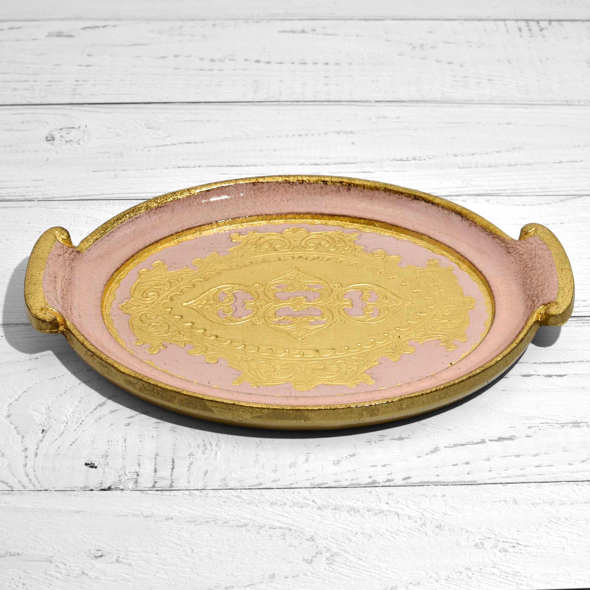 Decorative Florentine carved wood small oval tray with handles, featuring intricate pink floral designs, ideal for stylish home decor.