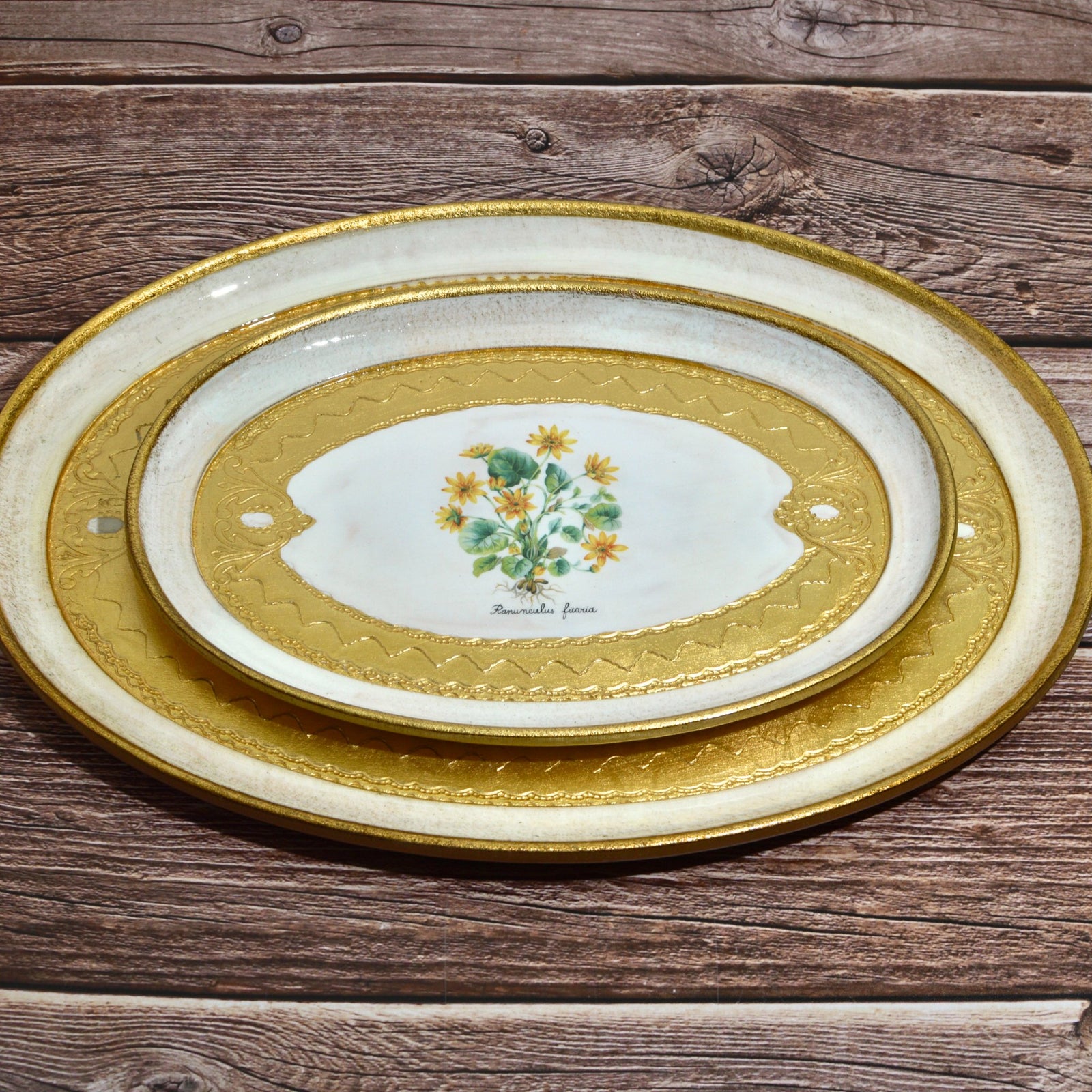 Decorative Florentine carved wood botanical oval trays with intricate floral patterns, perfect for elegant home decor.