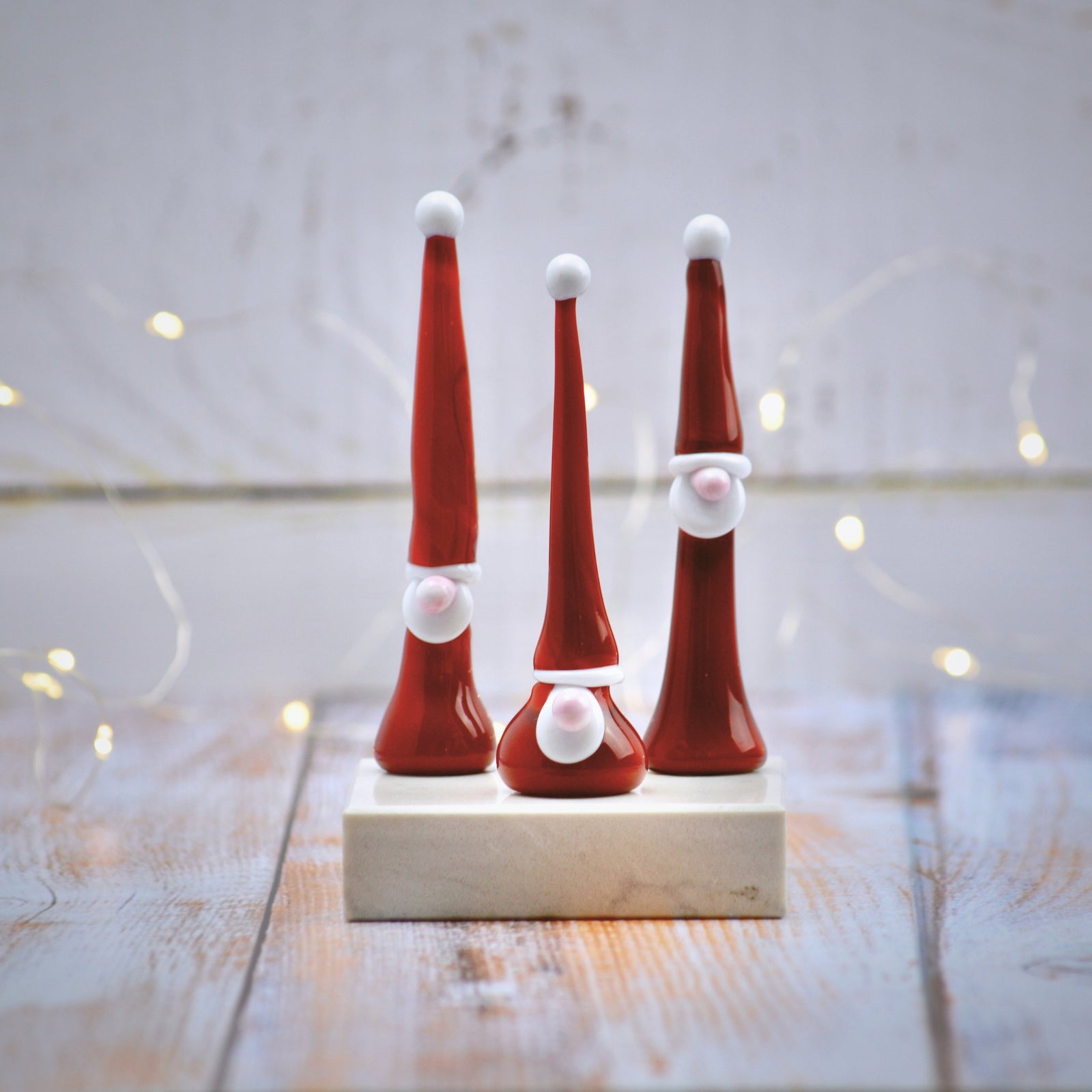 Set of three Murano glass gnome Santa figurines for holiday decorations, featuring colorful, handcrafted seasonal holiday decor.