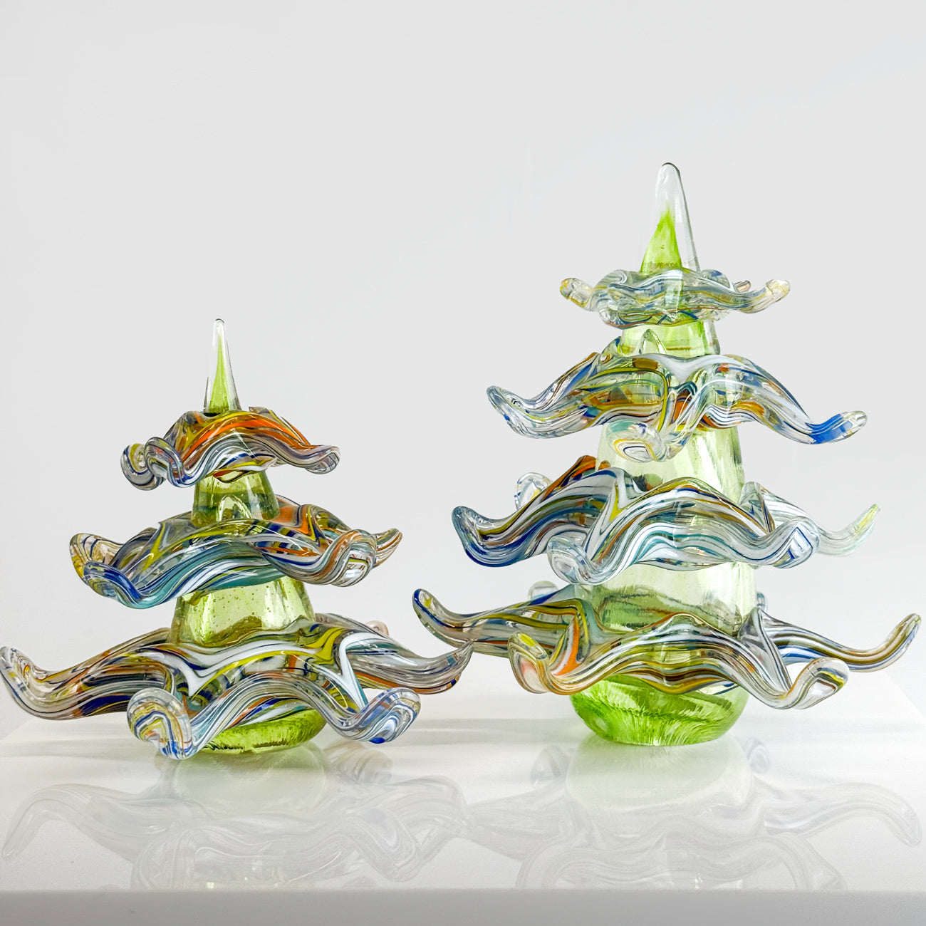 Murano glass 3D tree figurine, a seasonal holiday decoration made in Italy, featuring vibrant colors and intricate craftsmanship.