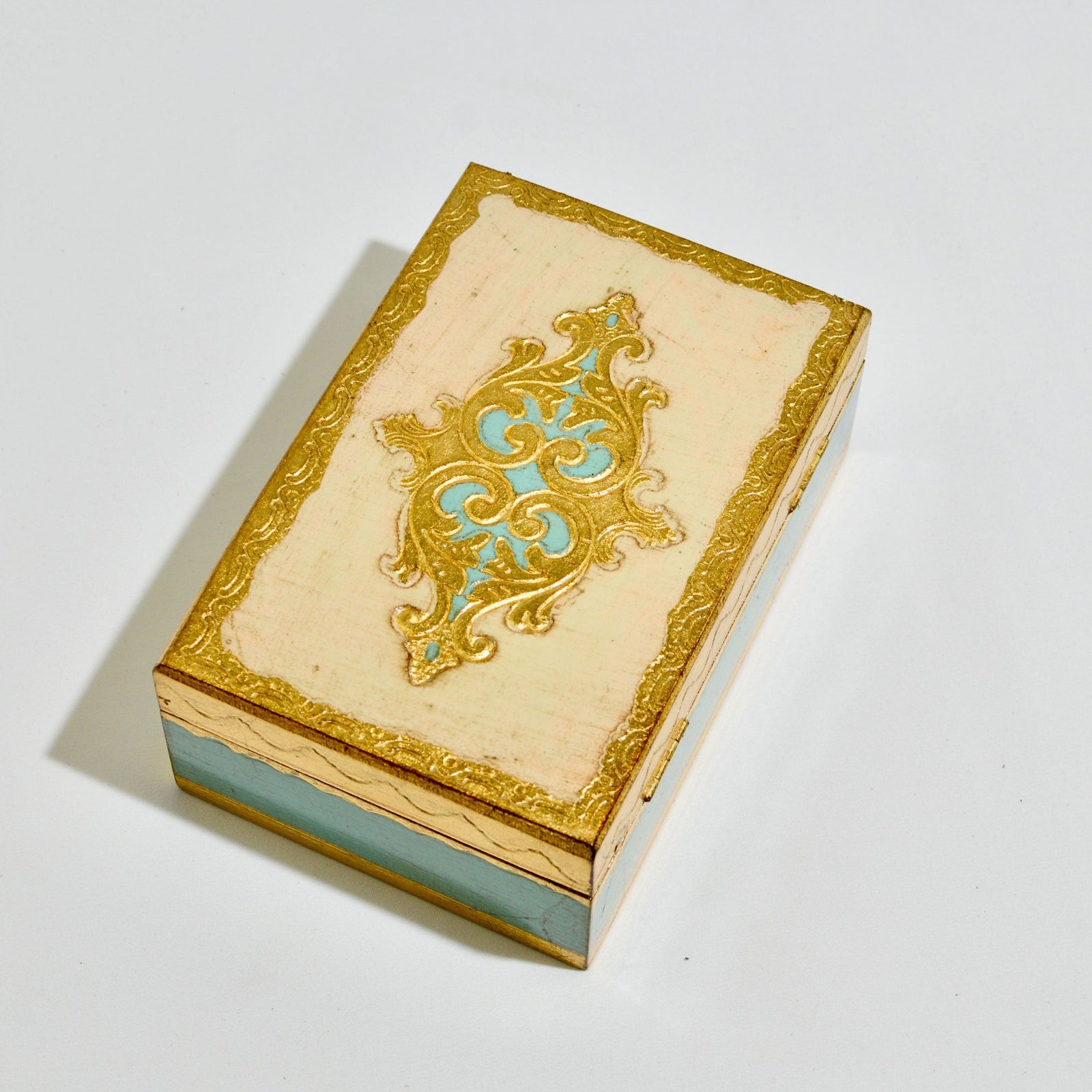 Stacked Florentine carved wood jewelry boxes by My Italian Decor, 4x6 inches with intricate decorative designs.