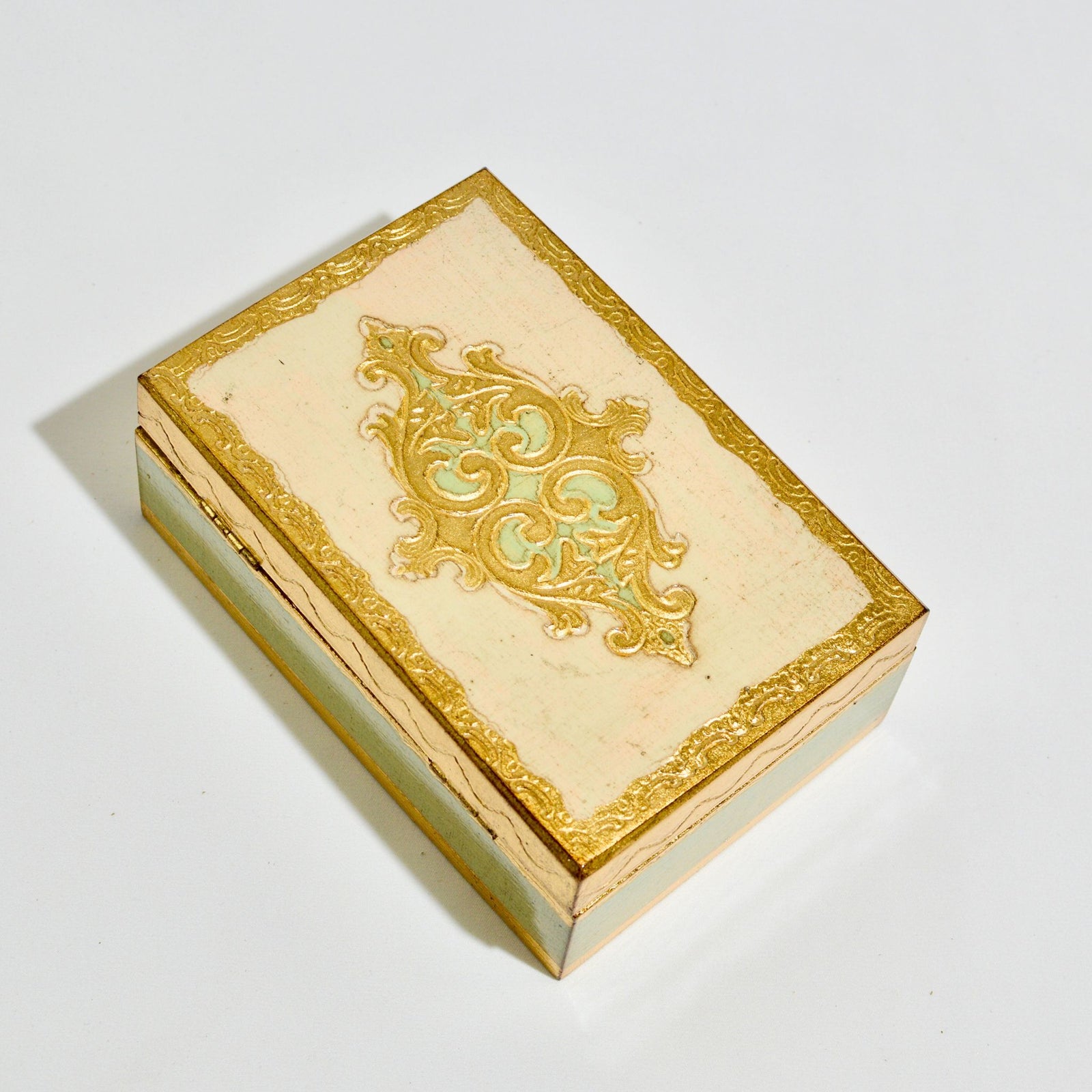 Stacked Florentine carved wood jewelry boxes by My Italian Decor, 4x6 inches with intricate decorative designs.