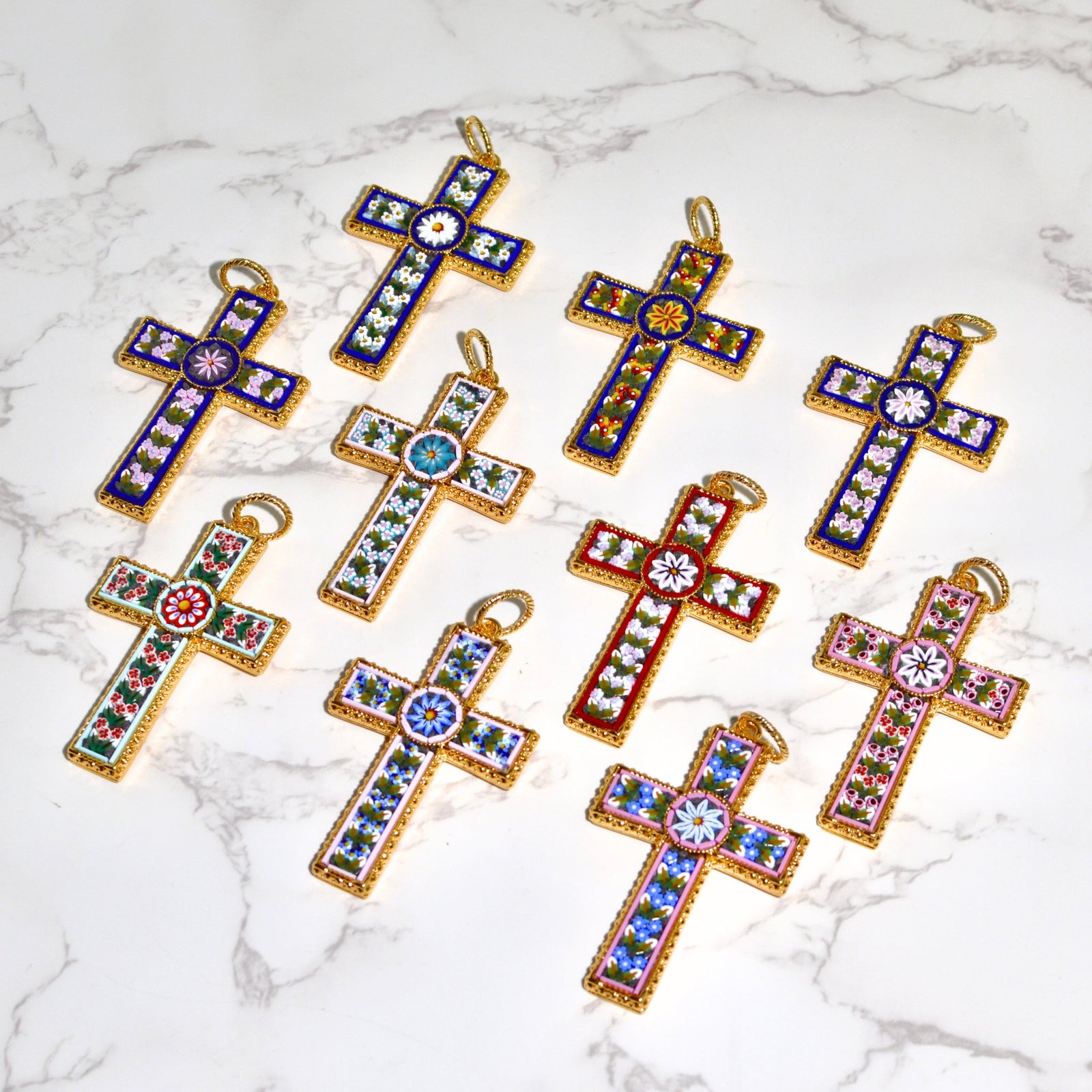 Close-up of large Florentine mosaic cross pendant with floral design, made in Italy, showcasing intricate craftsmanship and vibrant colors.