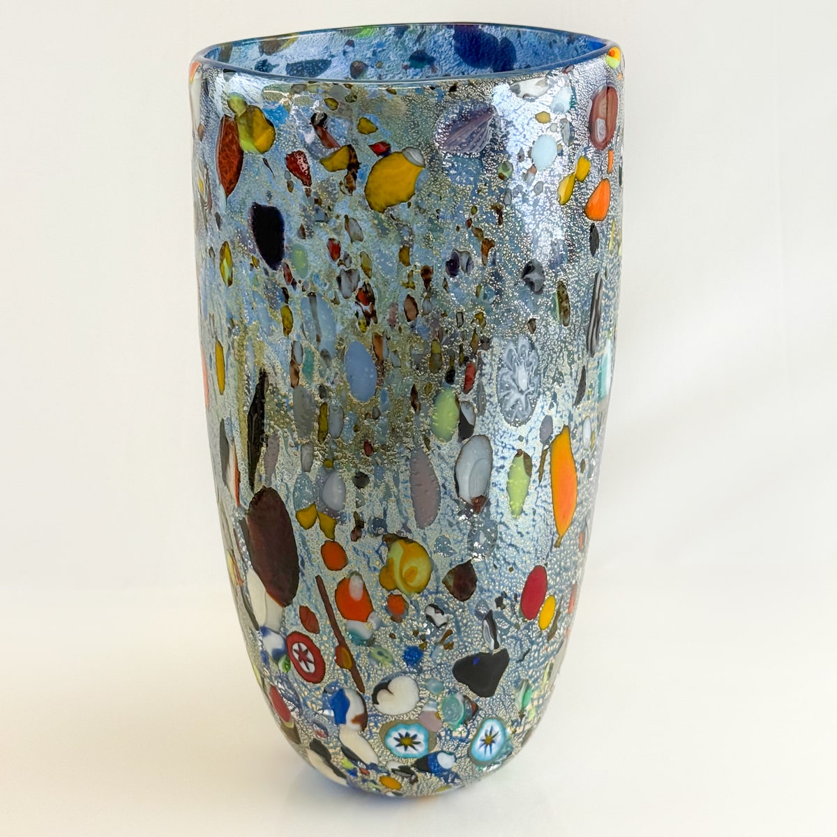 Large Concico Alta Murano glass vase displaying vibrant, handcrafted design with elegant curves and rich color.