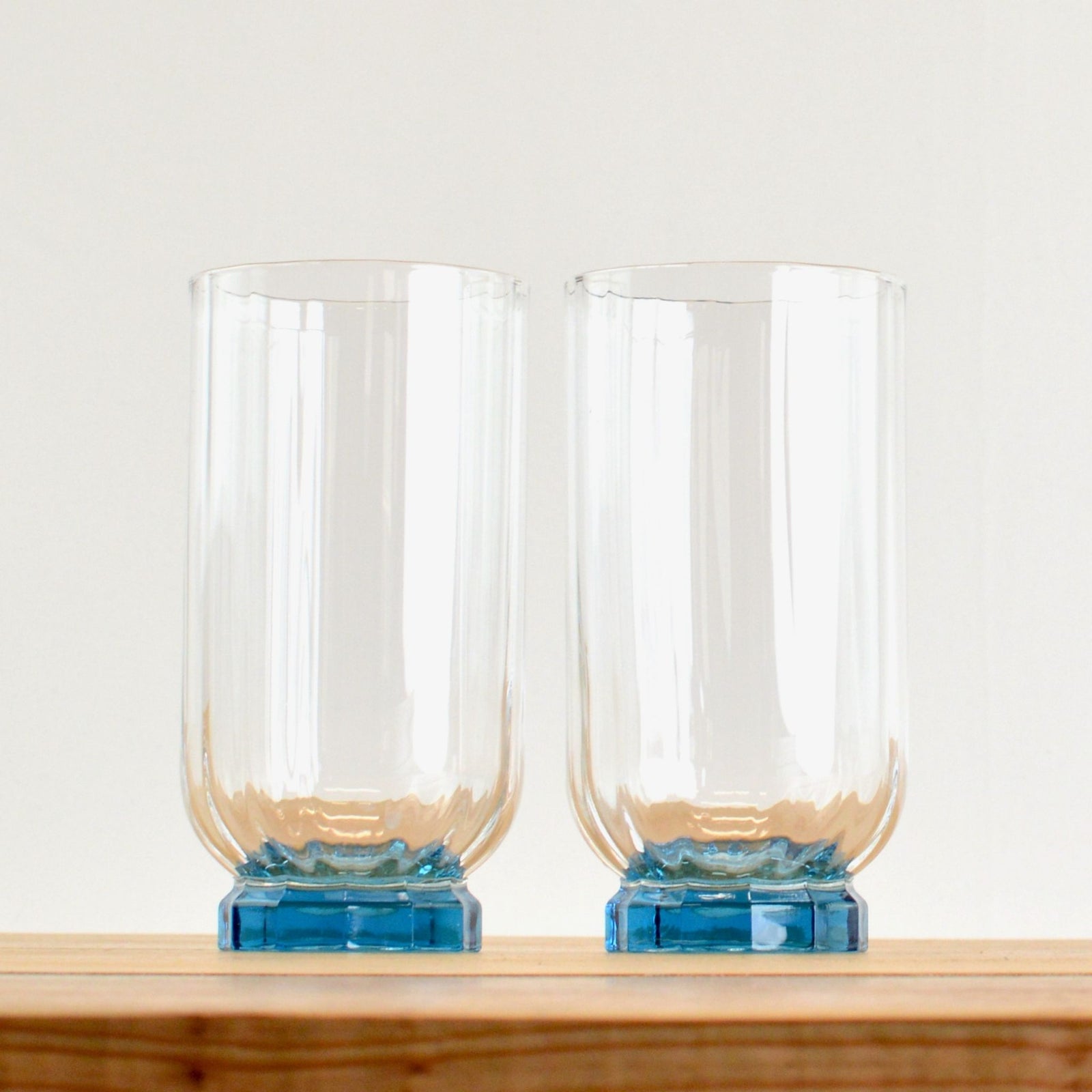 Set of two blue Florian glass tumblers, short and tall, by My Italian Decor, featuring clear glass with a sleek design.