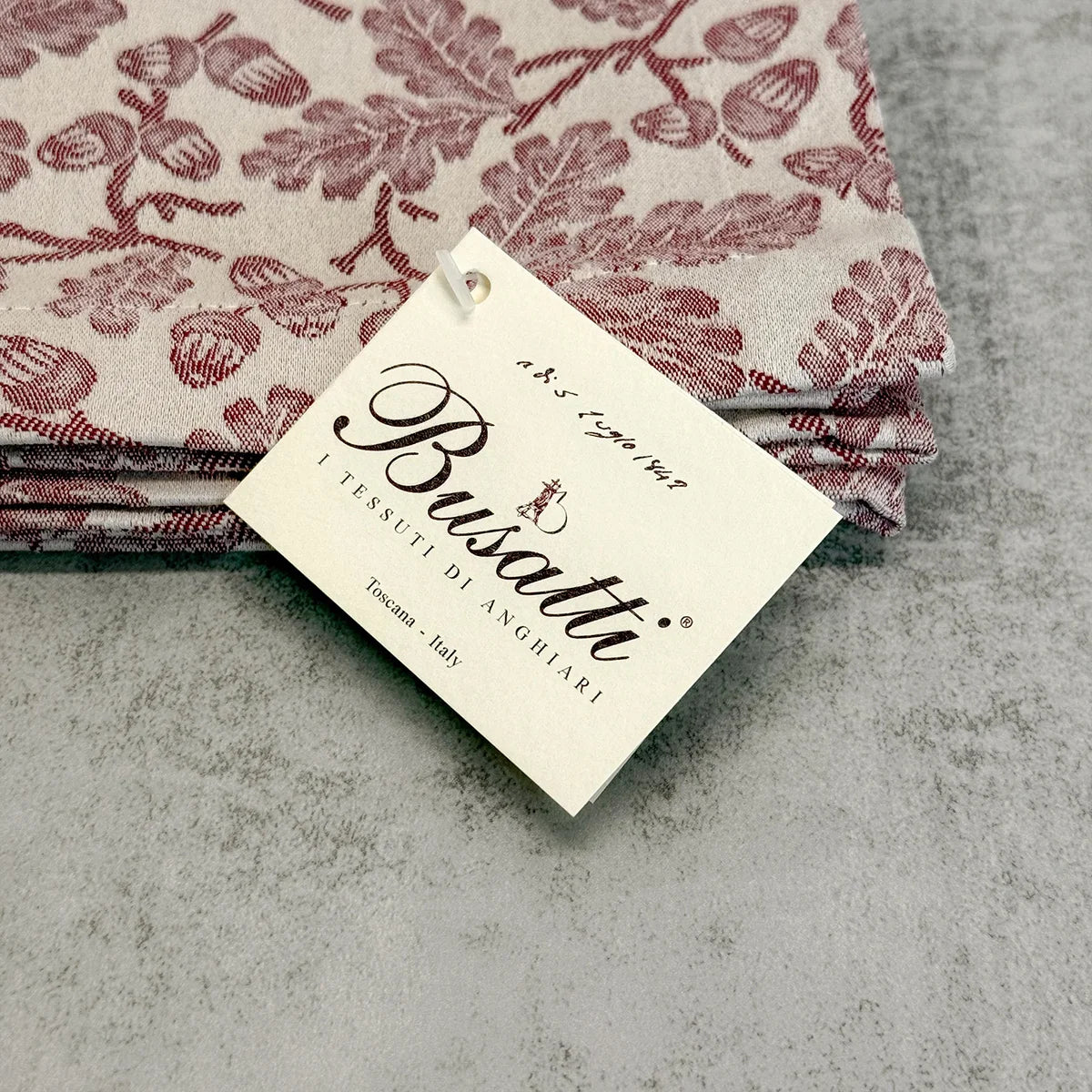 Busatti Acorn table runner made in Italy, featuring detailed woven design, perfect for elegant table linens.