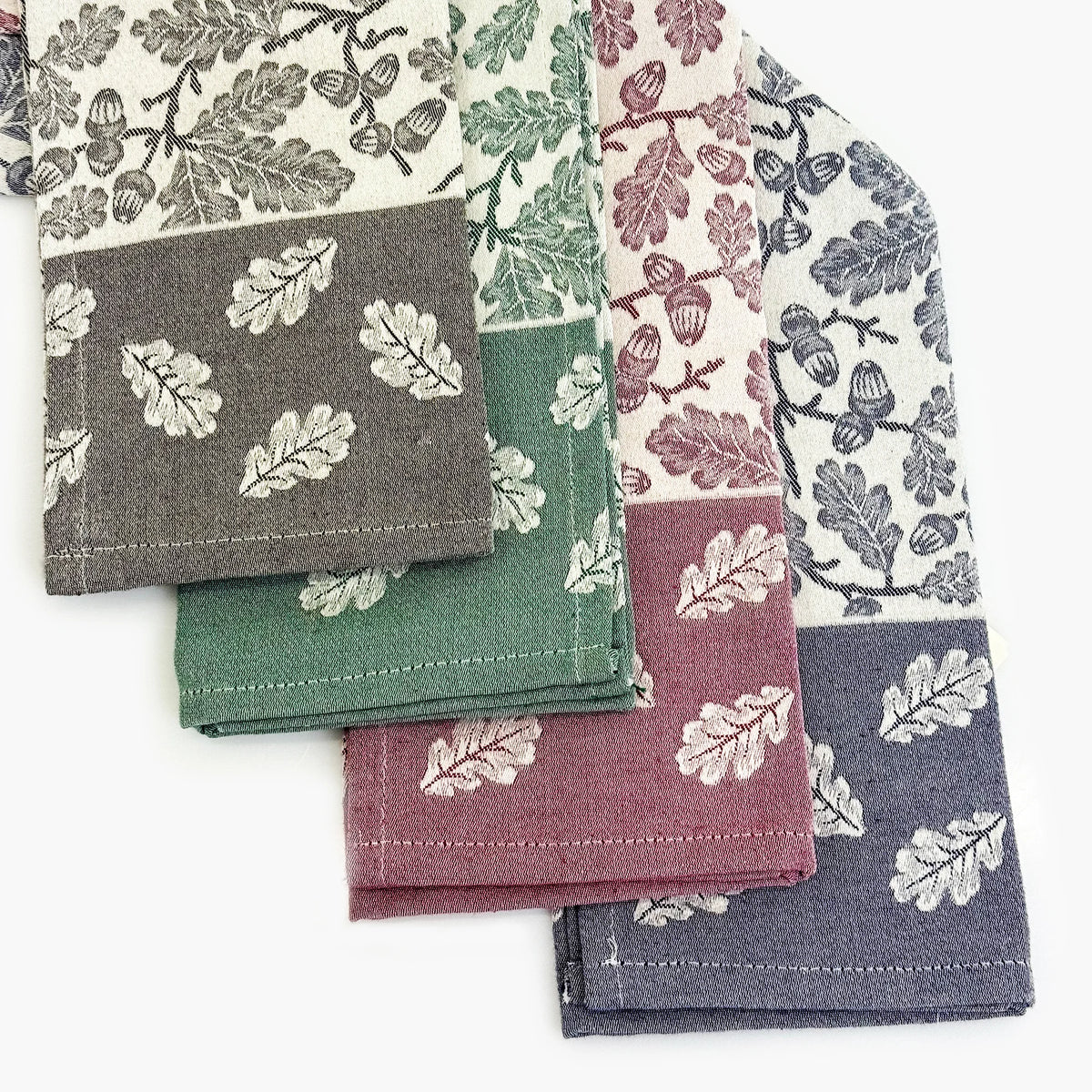 Busatti Acorn kitchen towel in assorted colors, made in Italy, featuring classic woven fabric and decorative oak leaf patterns.