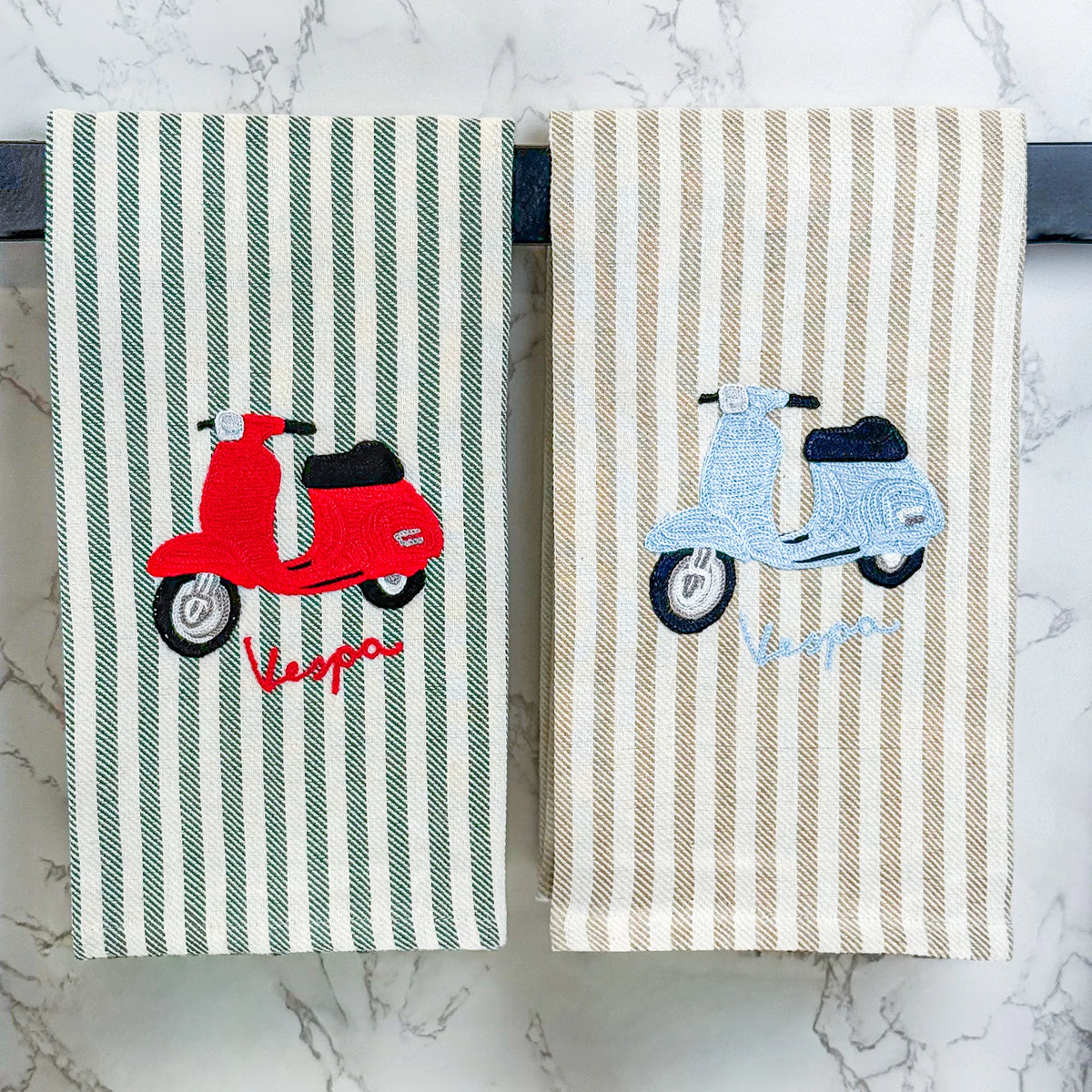 Busatti Vespa embroidered kitchen towel in assorted colors, made in Italy, featuring detailed Vespa scooter embroidery for stylish kitchen decor.