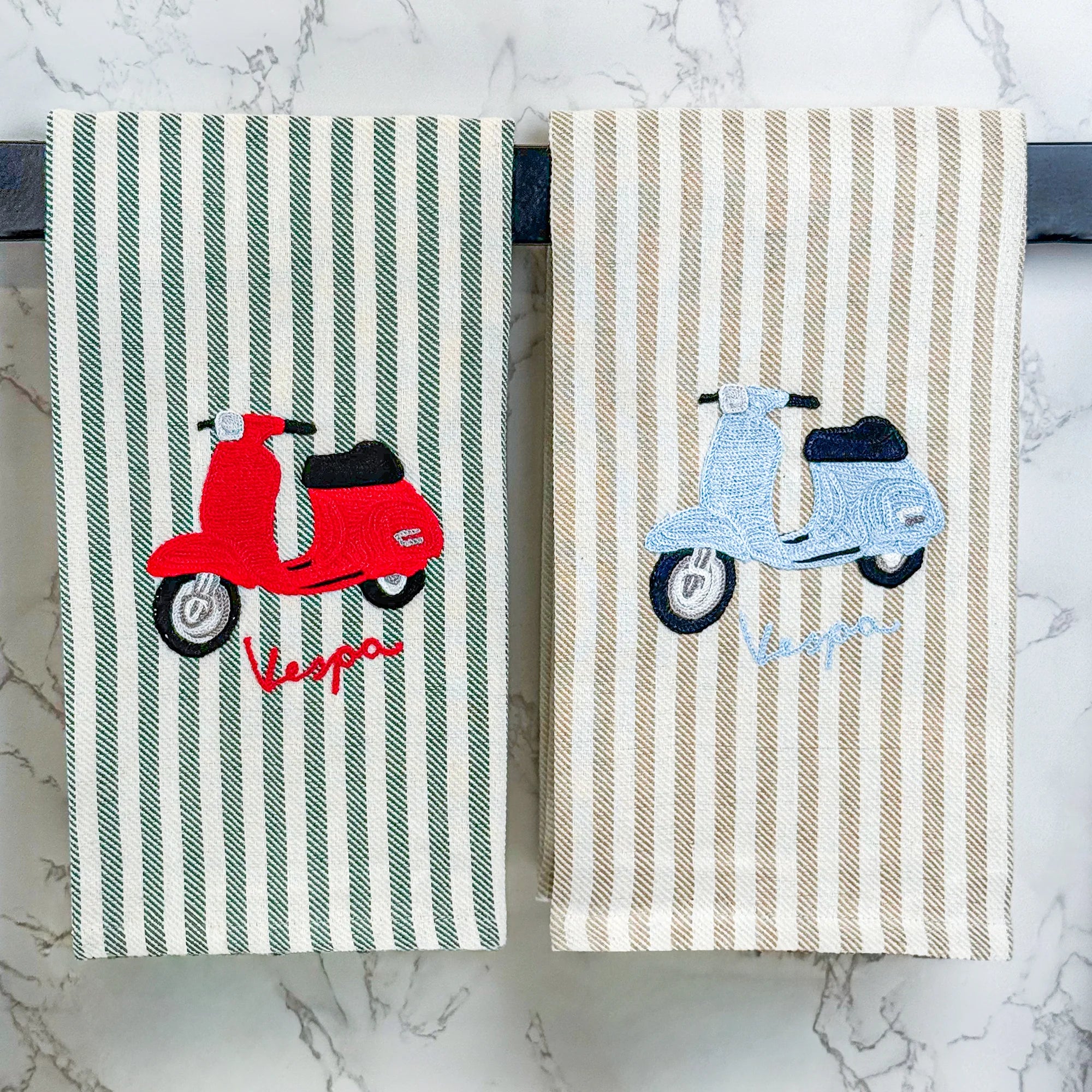 Busatti Vespa embroidered kitchen towel in assorted colors, made in Italy, featuring detailed Vespa scooter embroidery for stylish kitchen decor.