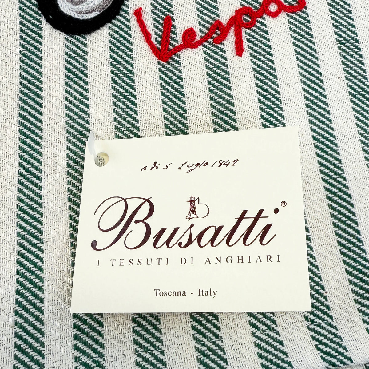Busatti Vespa embroidered kitchen towel in assorted colors, made in Italy, featuring detailed Vespa scooter embroidery for stylish kitchen decor.