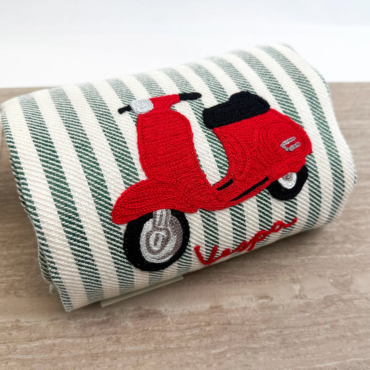 Busatti Vespa embroidered kitchen towel in assorted colors, made in Italy, featuring detailed Vespa scooter embroidery for stylish kitchen decor.