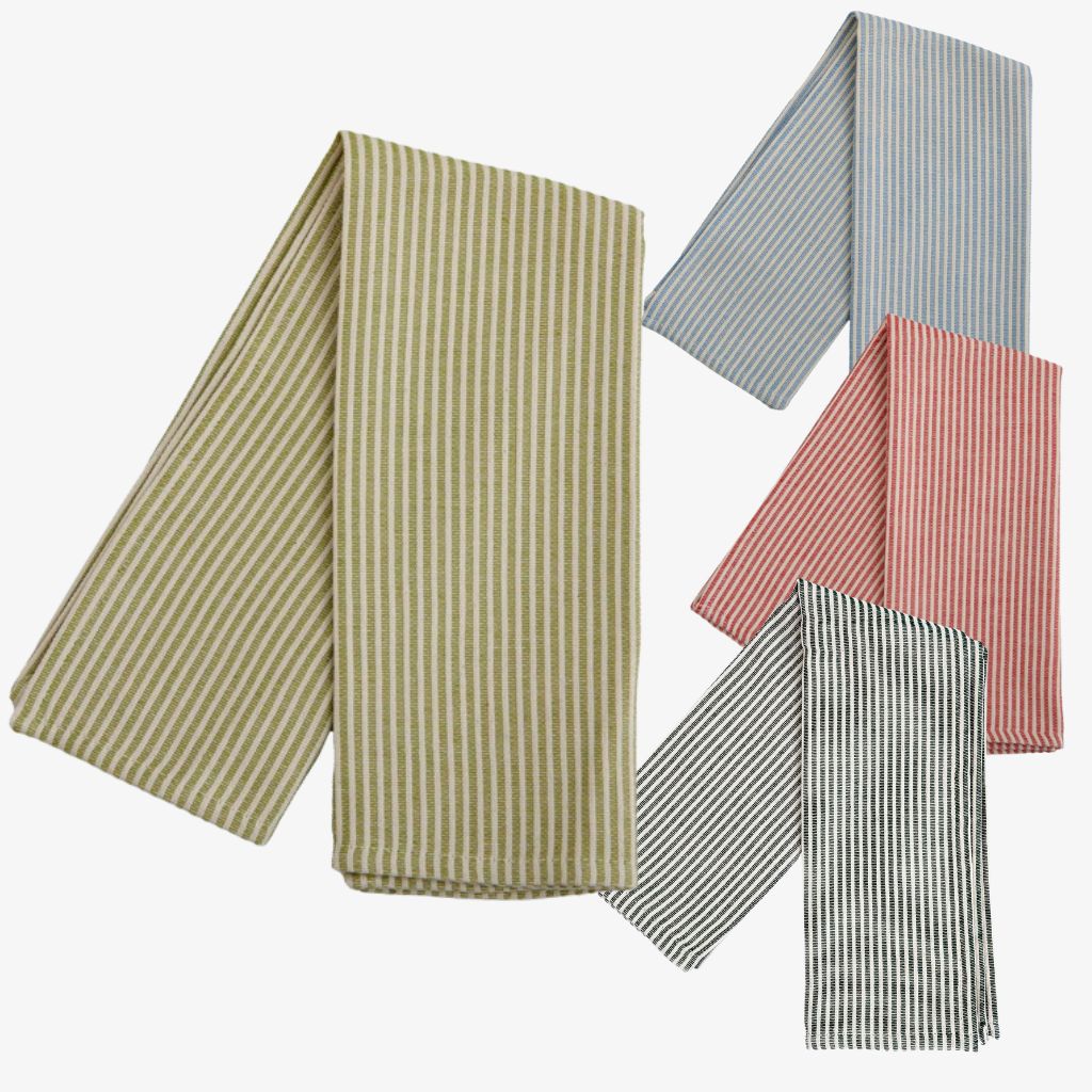 Busatti striped kitchen towel in assorted colors, made in Italy, with a woven pattern and soft fabric, displayed on a kitchen counter.