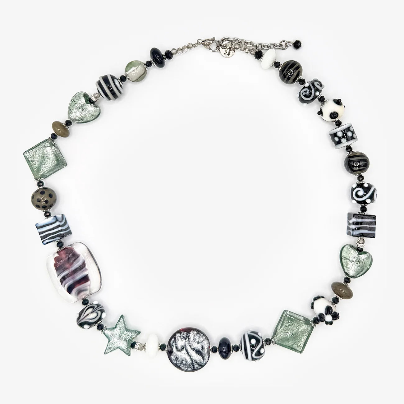 A handmade beaded necklace featuring a variety of glass beads in black, white, gray, and light green, with a silver-tone chain and clasp, displayed on a clean white background.