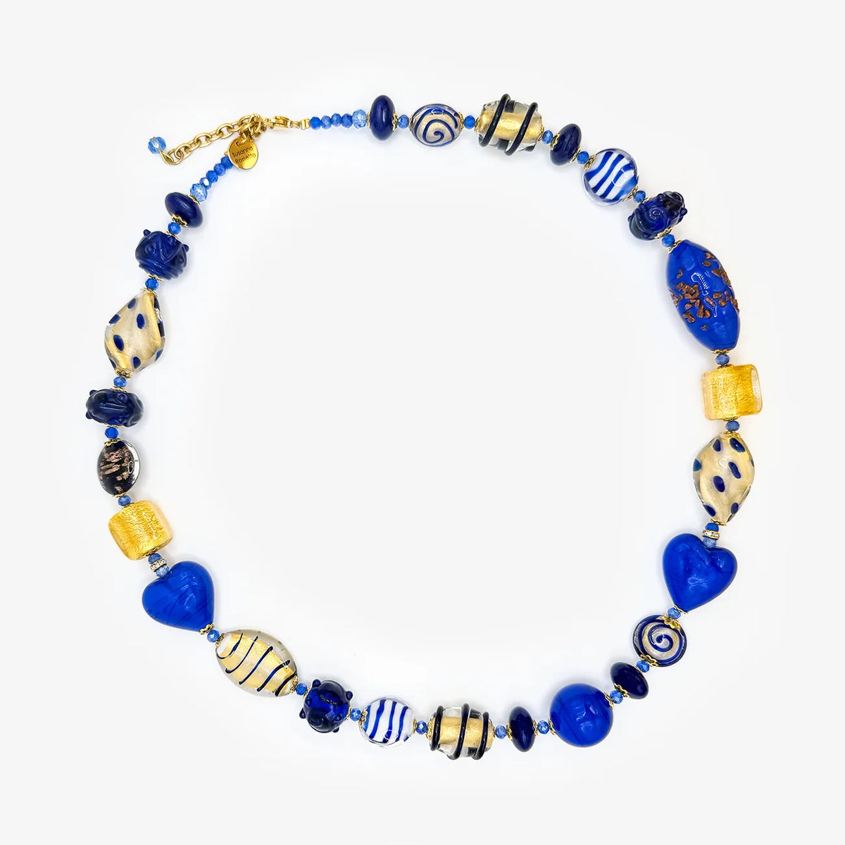 A handmade glass bead necklace featuring vibrant blue, deep navy, and cream-colored beads with various patterns including swirls, stripes, and hearts, displayed on a clean white background.