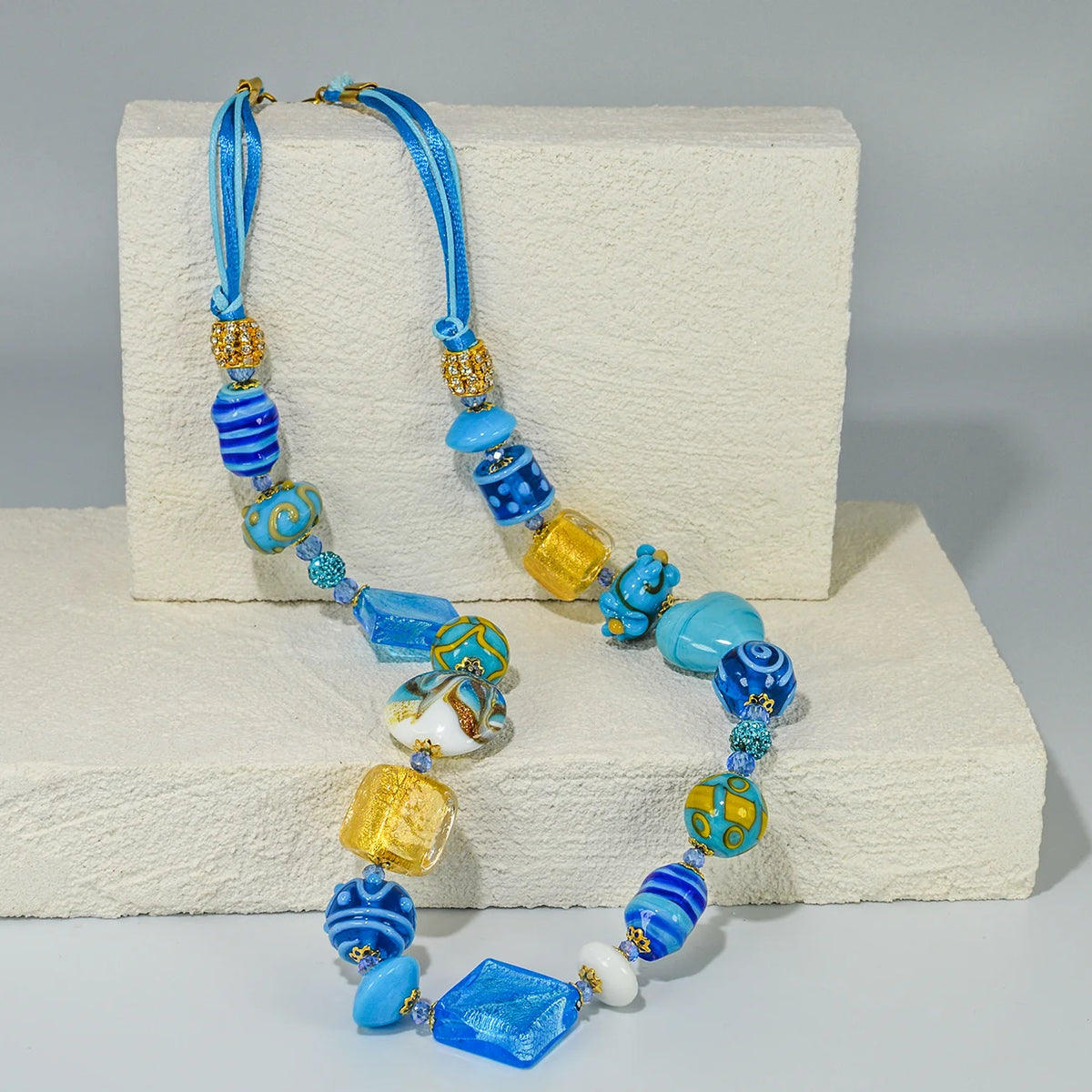 Colorful Murano glass necklace with beaded design, crafted in Italy, featuring vibrant glass beads and a stylish statement look.