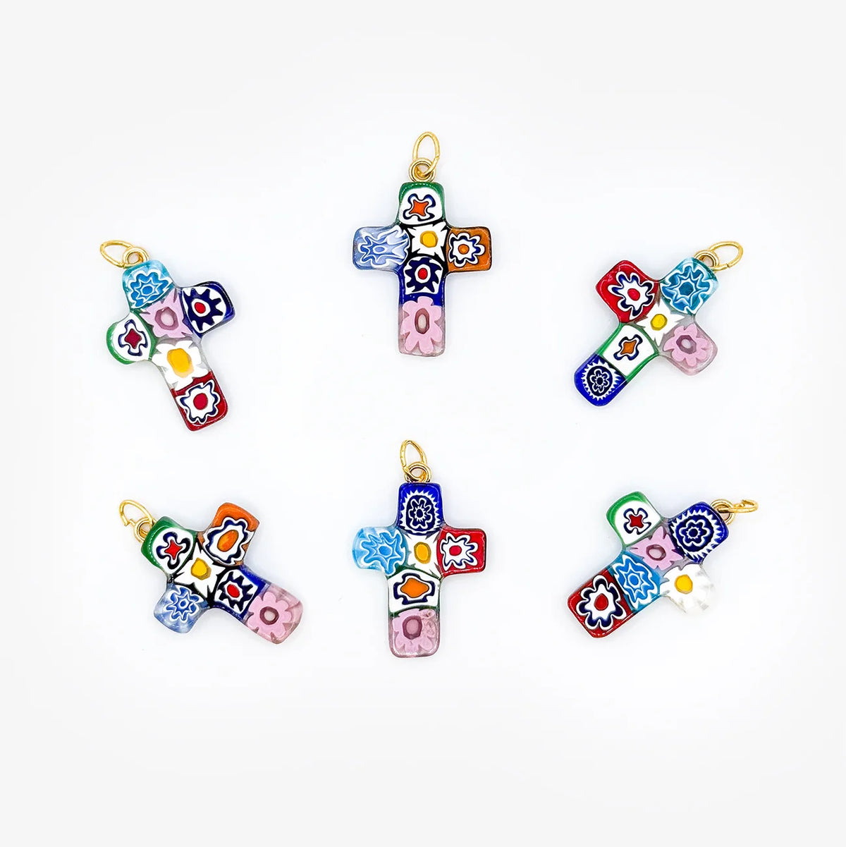 Millefiori cross pendant made in Italy, featuring colorful glass design, hanging from a silver chain.