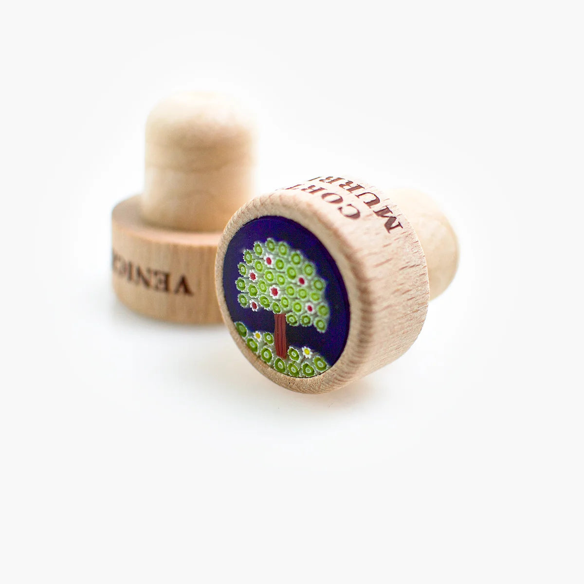 Murano glass wood wine stopper with tree design, made in Italy, for sealing bottles and preserving wine freshness.