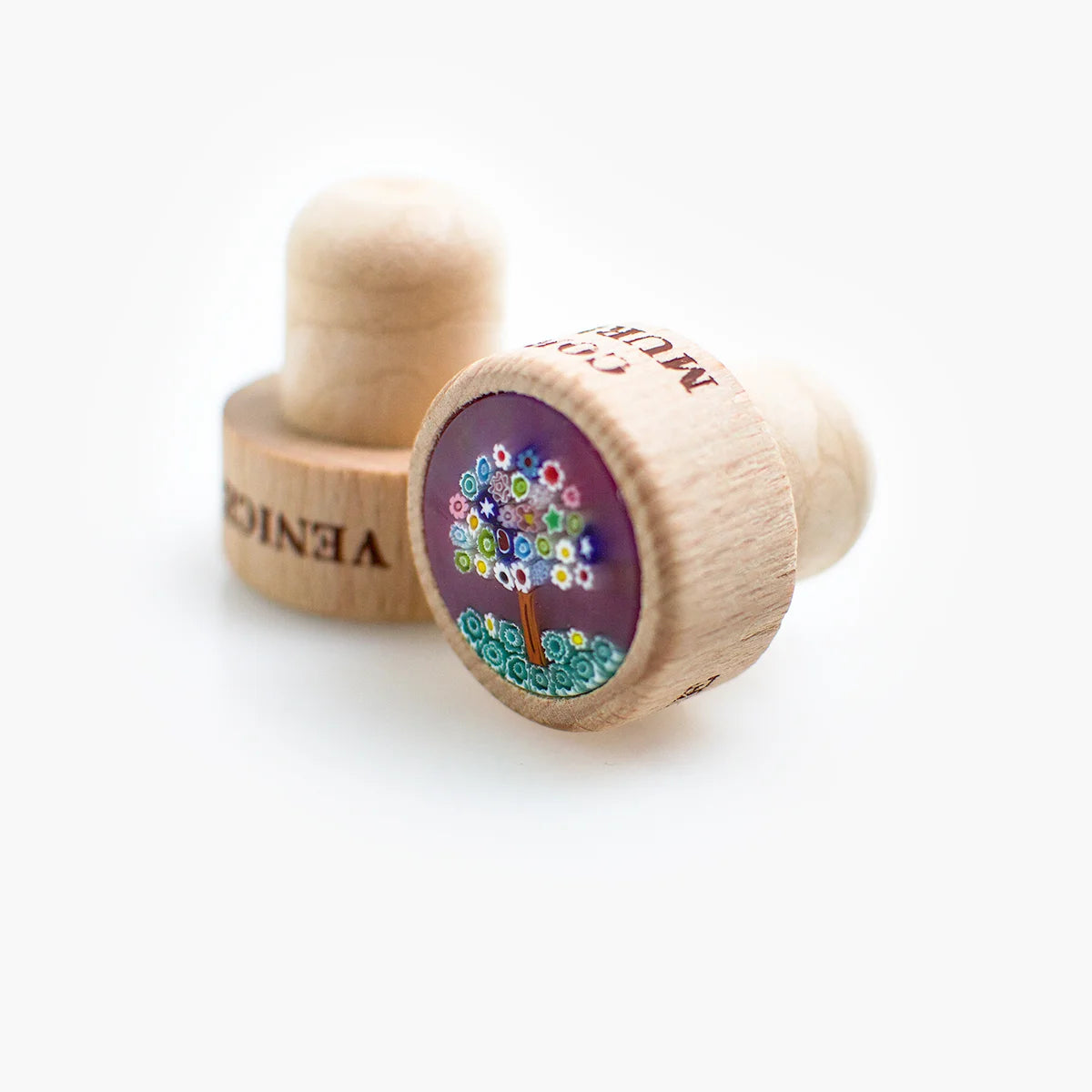 Murano glass wood wine stopper with tree design, made in Italy, for sealing bottles and preserving wine freshness.