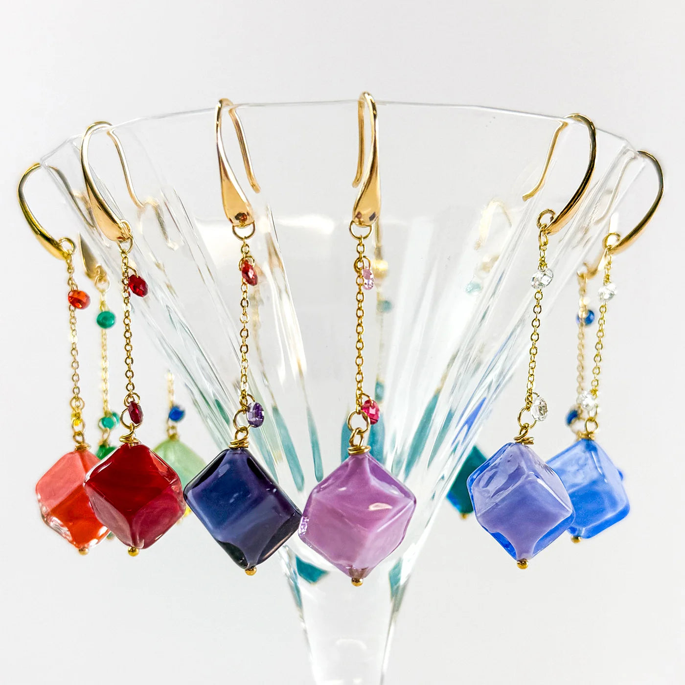 Hanging bead earrings from Dolce Collection featuring colorful Murano glass cubes on a chain, stylish and handcrafted jewelry.