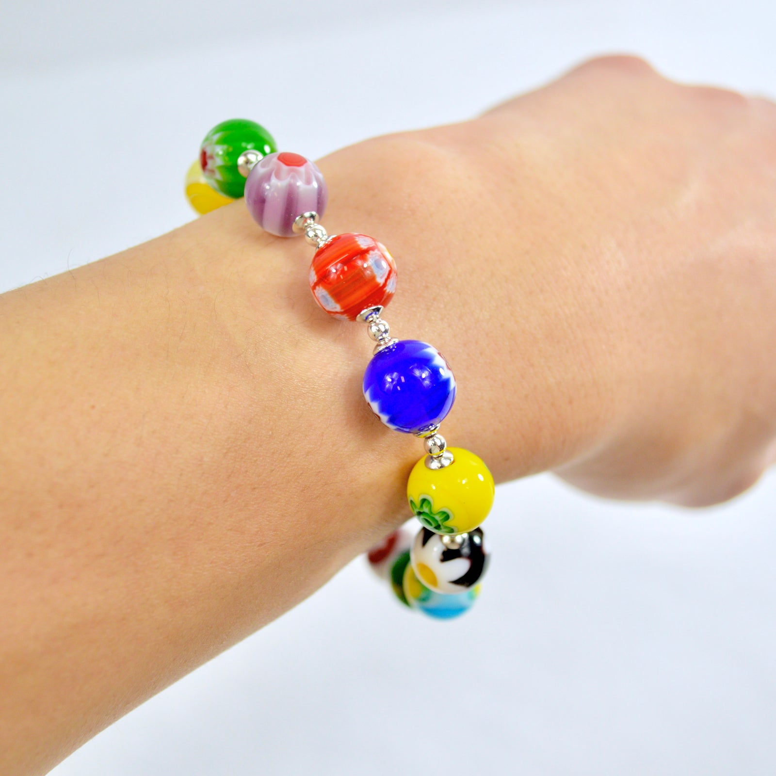 Side view of DZ Murano Glass Millefiori Bead Bracelet with clasp, showcasing colorful handcrafted glass beads made in Italy.