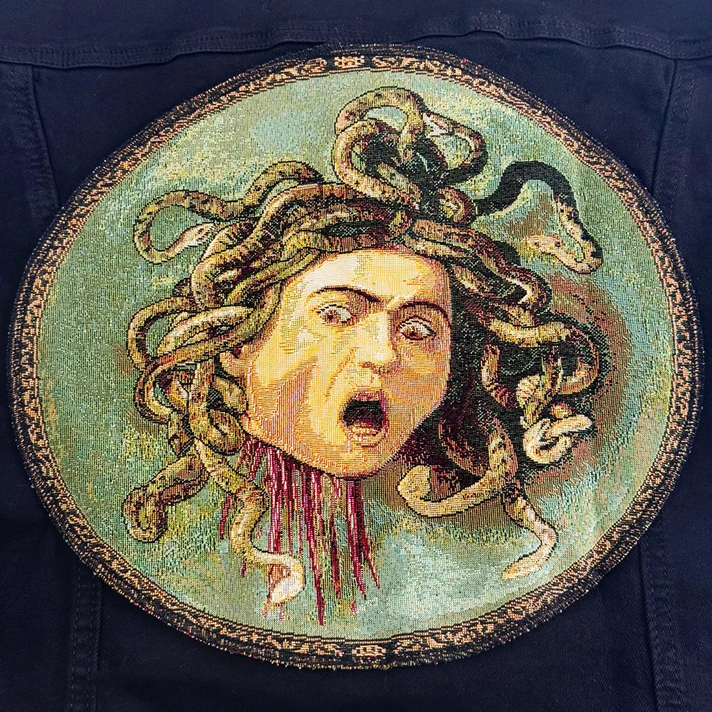 Light blue denim jacket by My Italian Decor featuring vibrant Italian art tapestry embroidery on the back.