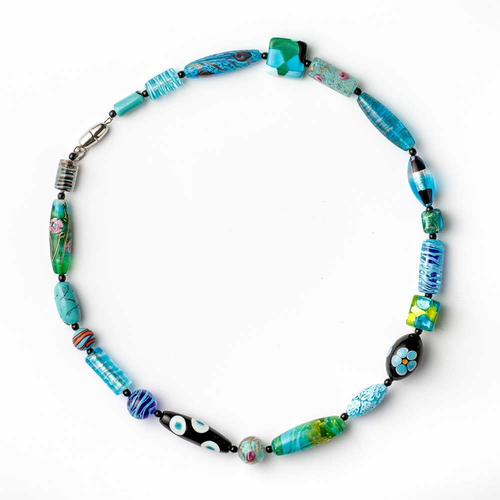 Light blue Murano glass melting pot necklace featuring a smooth, colorful pendant on a delicate chain by My Italian Decor.