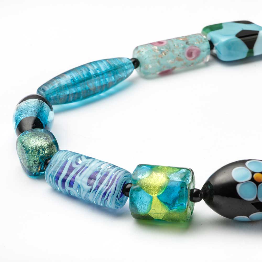 Light blue Murano glass melting pot necklace from My Italian Decor, featuring vibrant, handcrafted Italian glass jewelry.