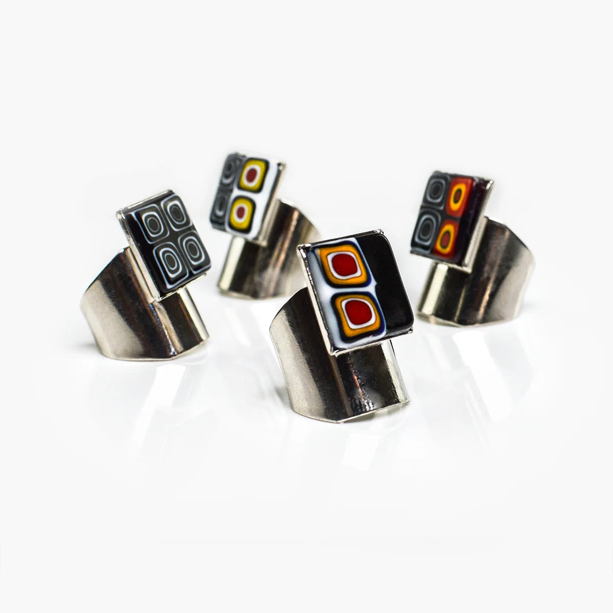 Adjustable Millefiori Murano glass rings with colorful floral patterns, crafted by My Italian Decor, showcasing vibrant glass artistry.