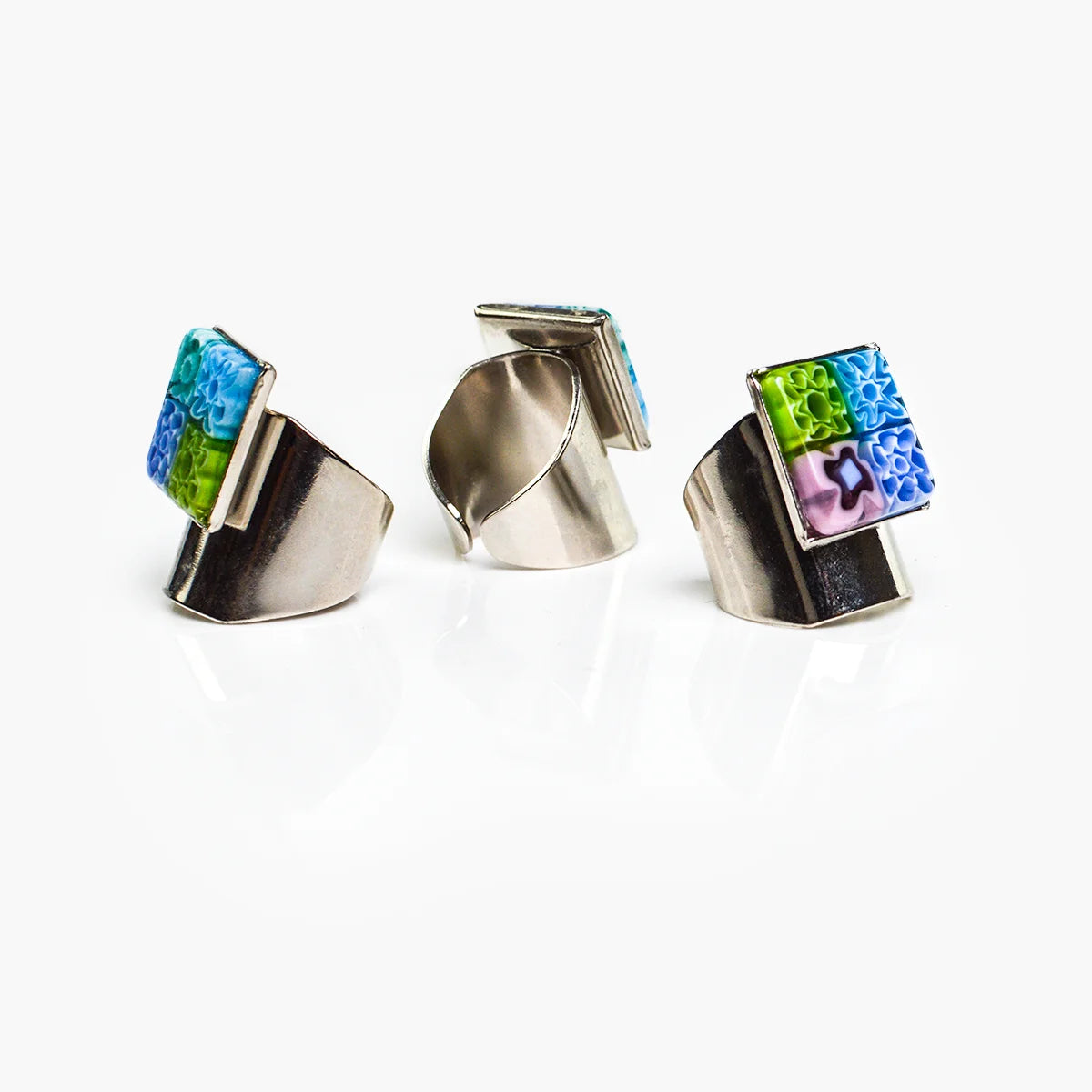 Adjustable Millefiori Murano glass rings by My Italian Decor, featuring colorful floral glass patterns on silver-tone bands.
