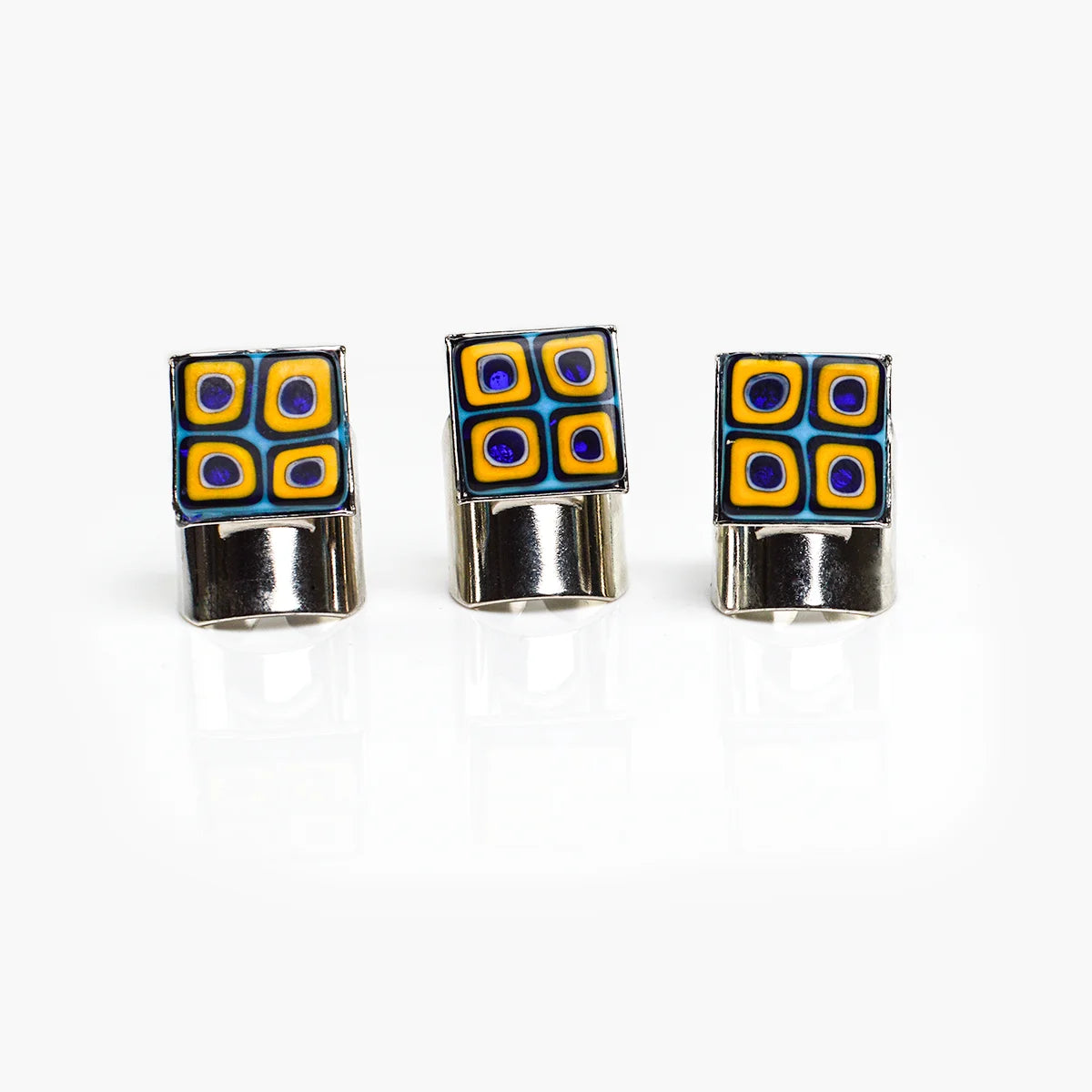 Adjustable Millefiori Murano glass rings with colorful floral patterns, crafted by My Italian Decor, displayed on a white background.