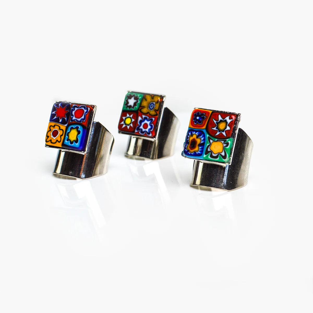 Adjustable Millefiori Murano glass rings with colorful floral patterns, crafted by My Italian Decor, featuring vibrant glass art designs.