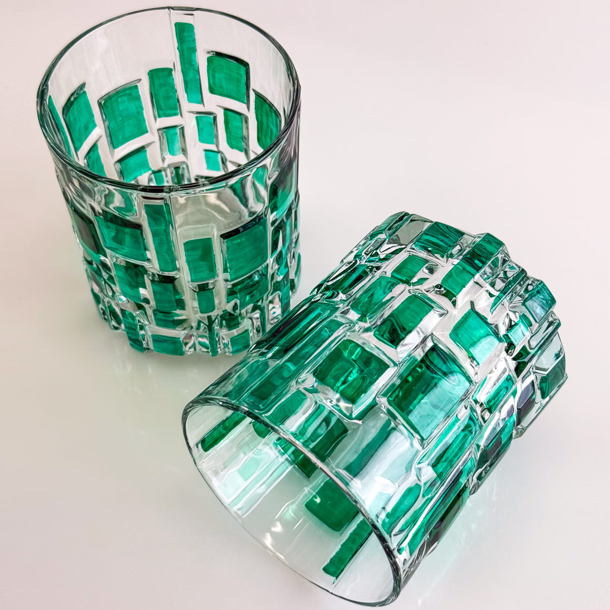 DZ Etna hand-painted Italian crystal short tumblers in vibrant green, showcasing intricate glassware design and craftsmanship.