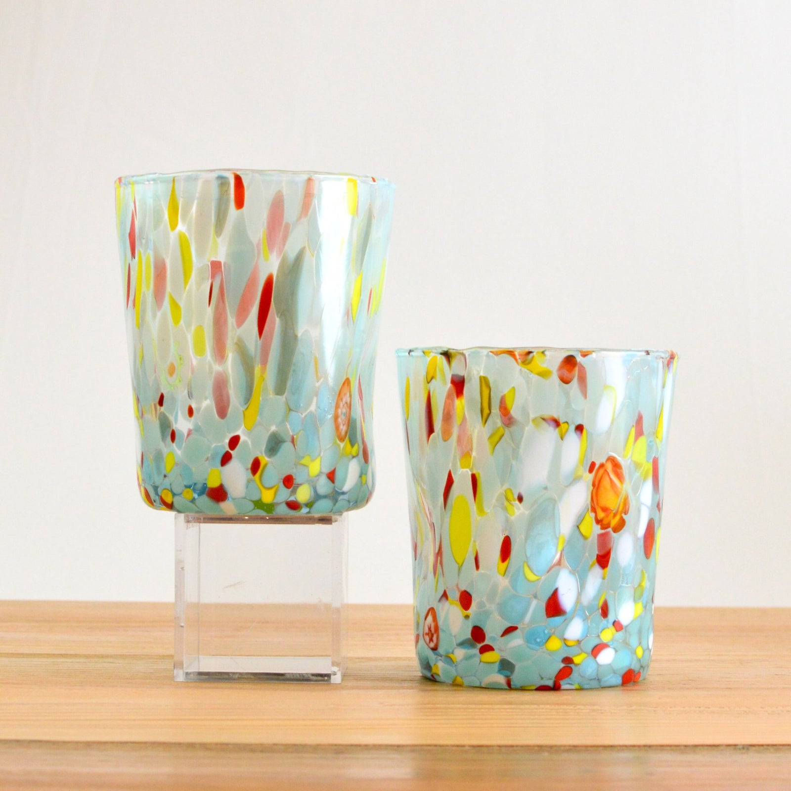 Set of four light blue Italian glass pitchers or drinking glasses by Franco, ideal for serving beverages in style.