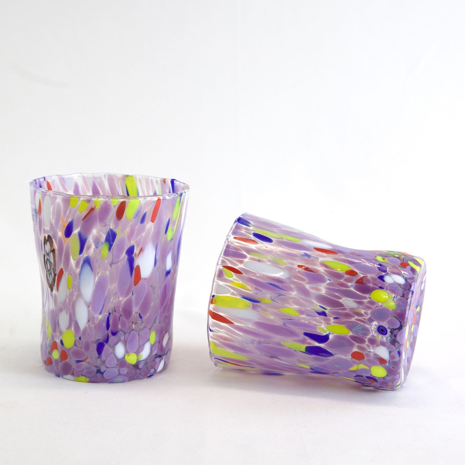 Set of 2 handblown Franco Viola glass tumblers with colorful violet patterns, perfect for stylish drinks or water.