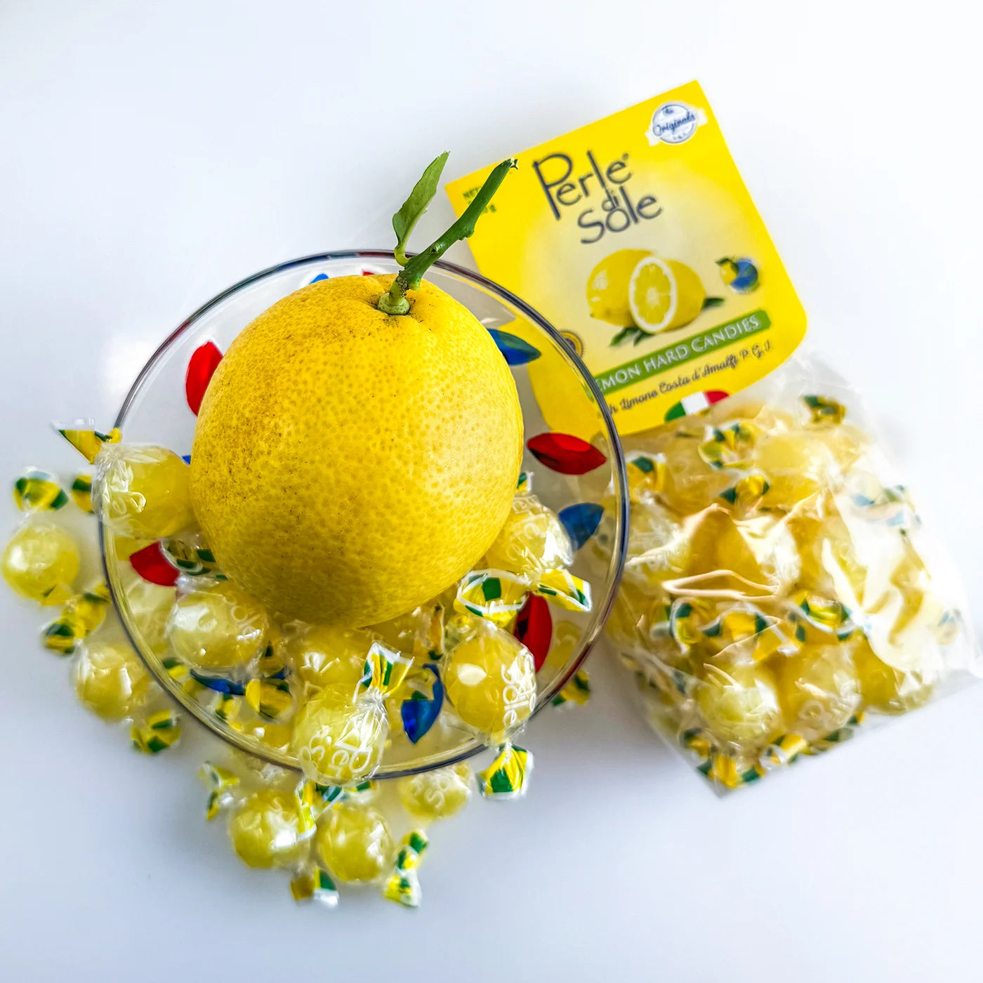Lemon-shaped candy bowl filled with colorful Italian hard candies, decorative ceramic bowl by My Italian Decor.