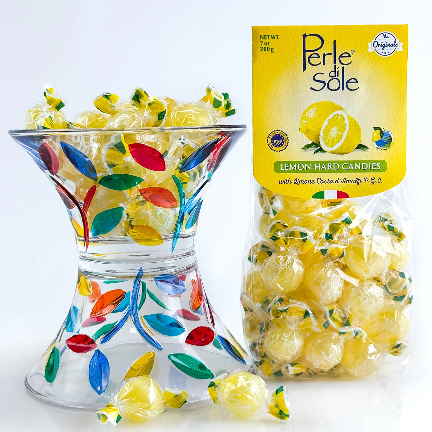 Lemon-colored ceramic candy bowl filled with colorful Italian hard candies, displayed on a table for decorative use.
