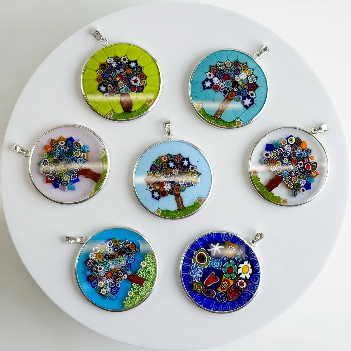Sterling silver Millefiori Pendant Tree of Life necklace with 1.3-inch rim, featuring colorful floral glass design on a chain.