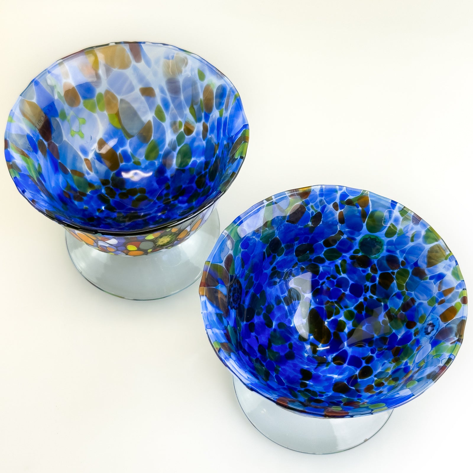Set of two Italian glass footed ice cream bowls with elegant design, perfect for serving desserts in style.
