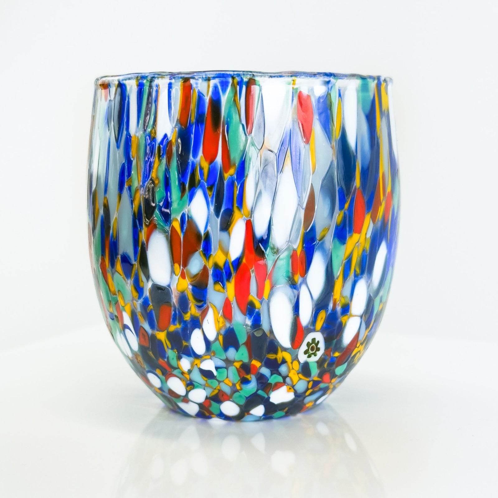 Set of two Italian-made Confetti drinking glass tumblers with colorful confetti design, perfect for serving beverages in style.