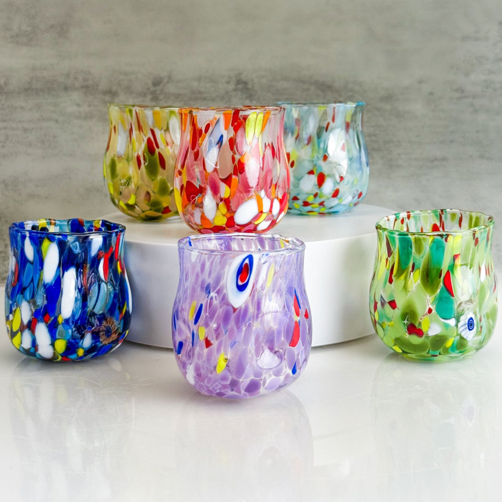 Set of 6 handcrafted blown glass shot glasses by MZ, made in Italy, featuring clear, elegant design for serving spirits.