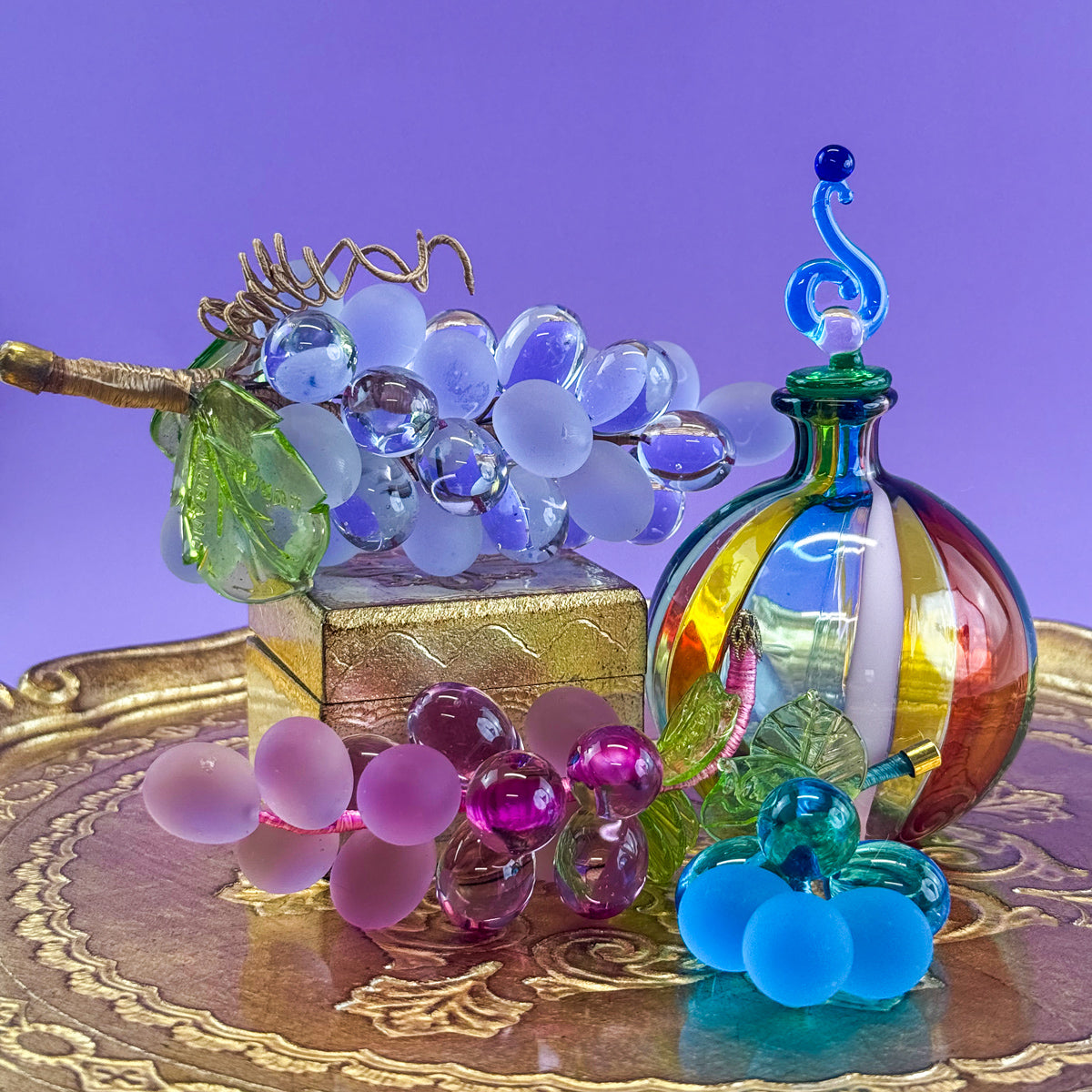 Colorful Murano glass small grape cluster artificial flora, made in Italy, featuring multiple vibrant hues and intricate glass craftsmanship.