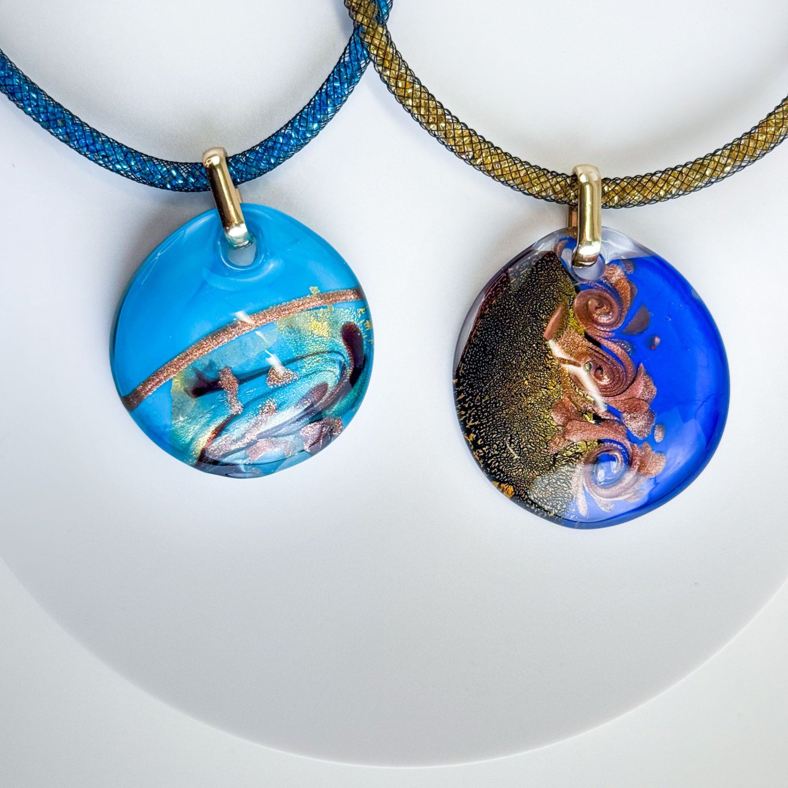 Large round Murano glass pendant from Rialto necklace featuring colorful handcrafted charms and a silver chain.