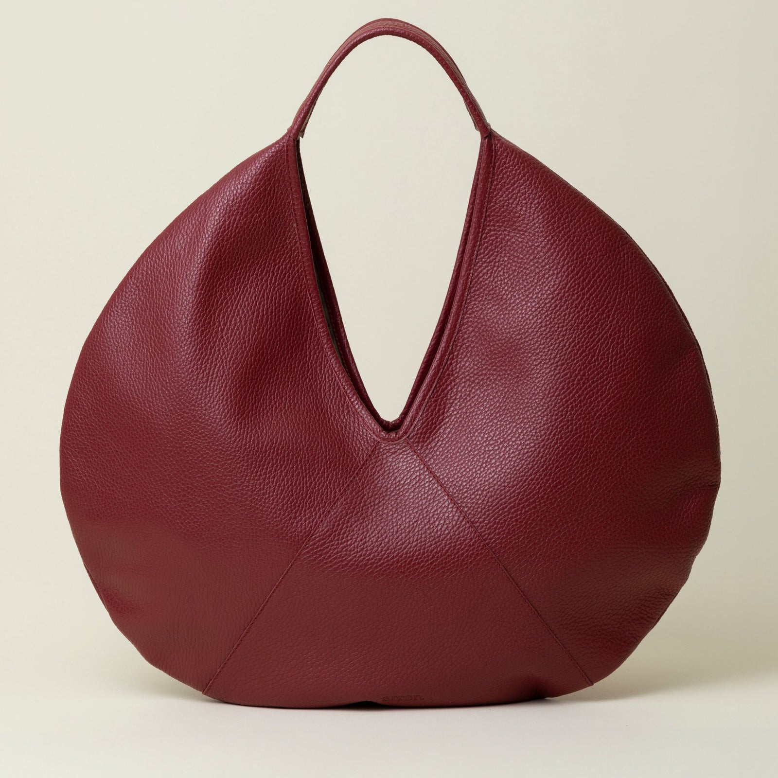 Noa Italian leather circle handbag with a round shape and sleek design, crafted by MyItalianDecor.